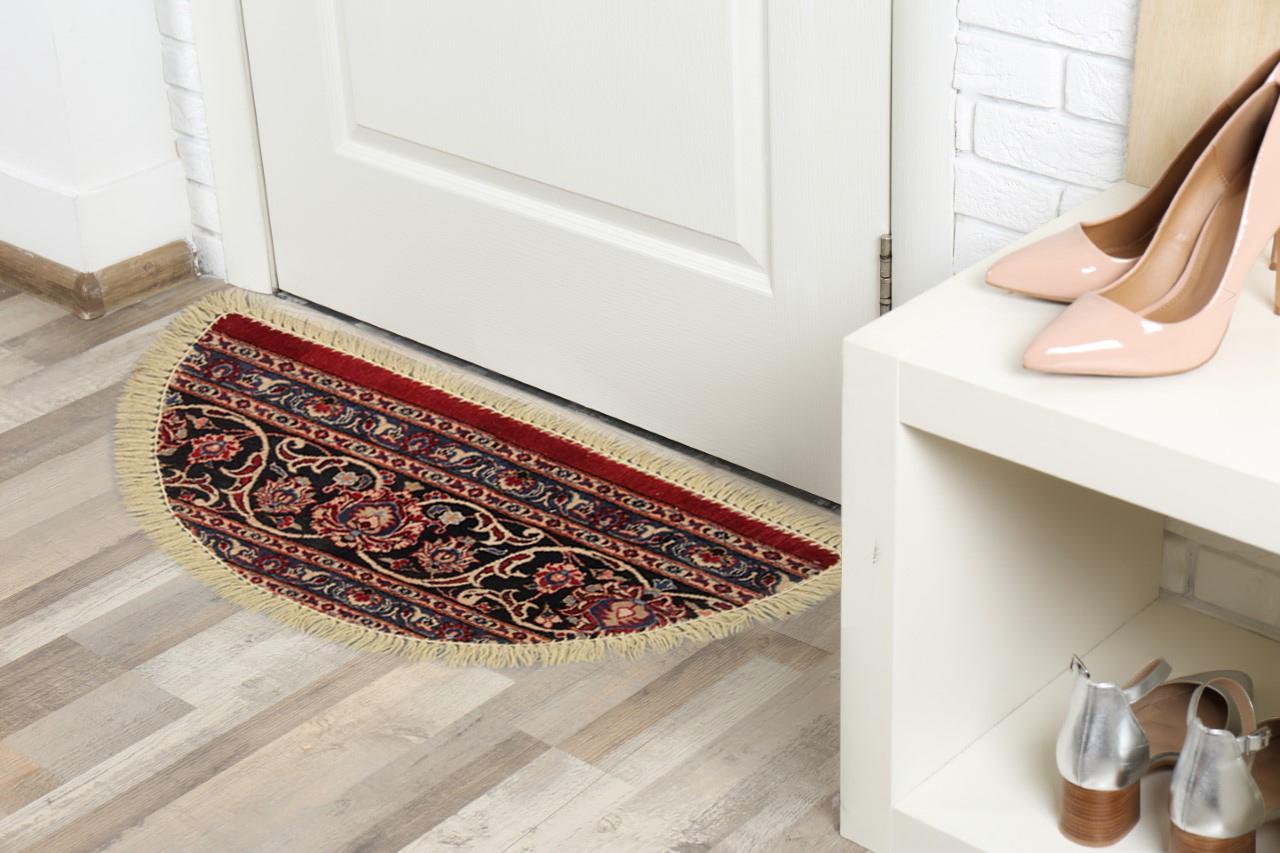 Handmade carpet Oriental rug featuring a traditional floral pattern woven in deep rich tones this little mat is perfect for any doorway in tour modern or traditional home. This semi-circle entranceway door mat has been refurbished from a handmade