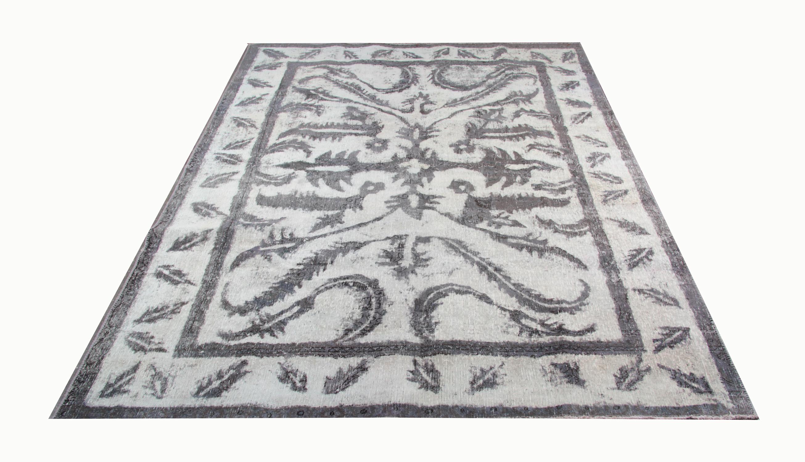 Handmade Carpet oriental overdyed rug and repainted this vintage oriental carpet is a stunning example of a vintage Turkish area rug. This predominantly grey rug also features various shades of brown, black and white, making it very easy to fit in