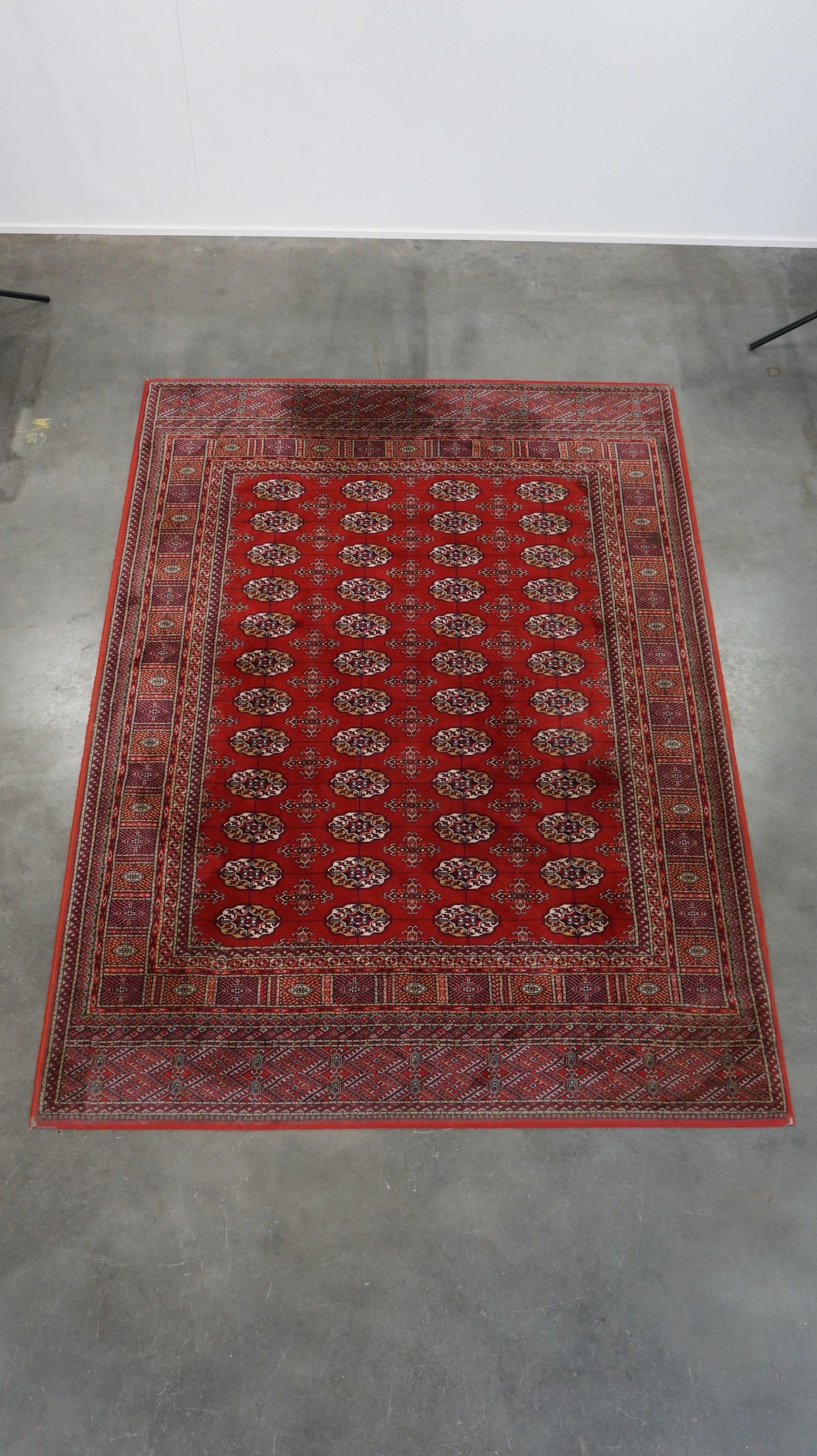 Tissé à la main Tapis oriental dans des tons chauds, principalement rouges 240x170cm en vente