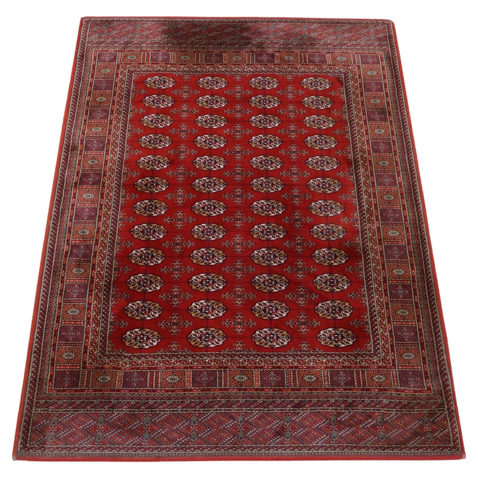 Oriental rug in warm, mainly red tones 240x170cm