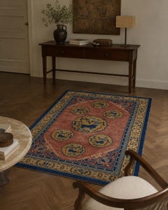 Hand-Knotted Oriental Rug with Guardian Motifs and Deep Blue Border