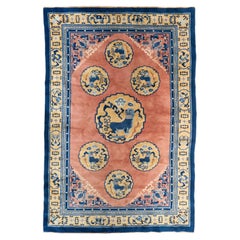 Hand-Knotted Oriental Rug with Guardian Motifs and Deep Blue Border