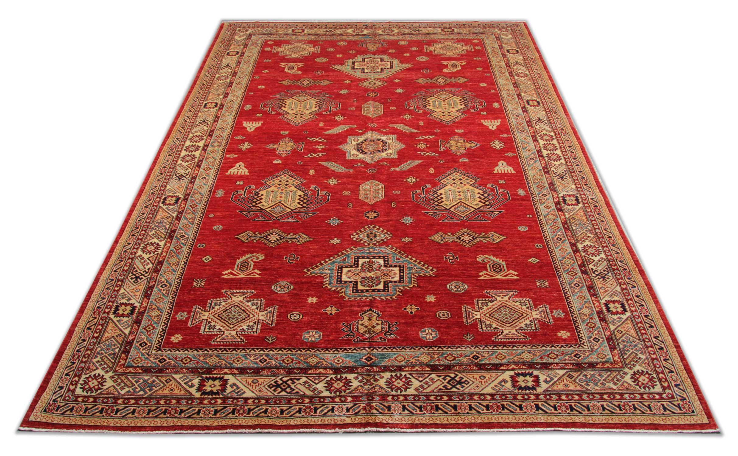 Handmade carpet Kazak large rugs are patterned oriental rugs primarily produced as village productions rather than city pieces. This red rug is made from organic materials particular to individual tribal provinces, and the rugs of the Caucasus