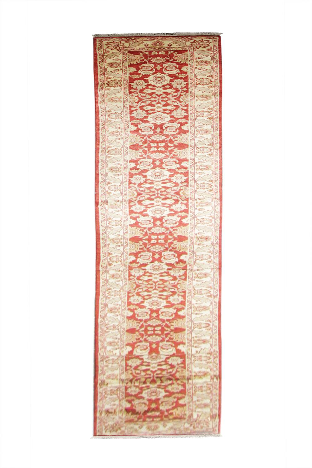 This handmade carpet is perfect for use as a living room rug. The layered border is beautifully woven with a repeat pattern throughout. The contrast between the deep red and beige hues works perfectly to create this eye-catching one of a kind