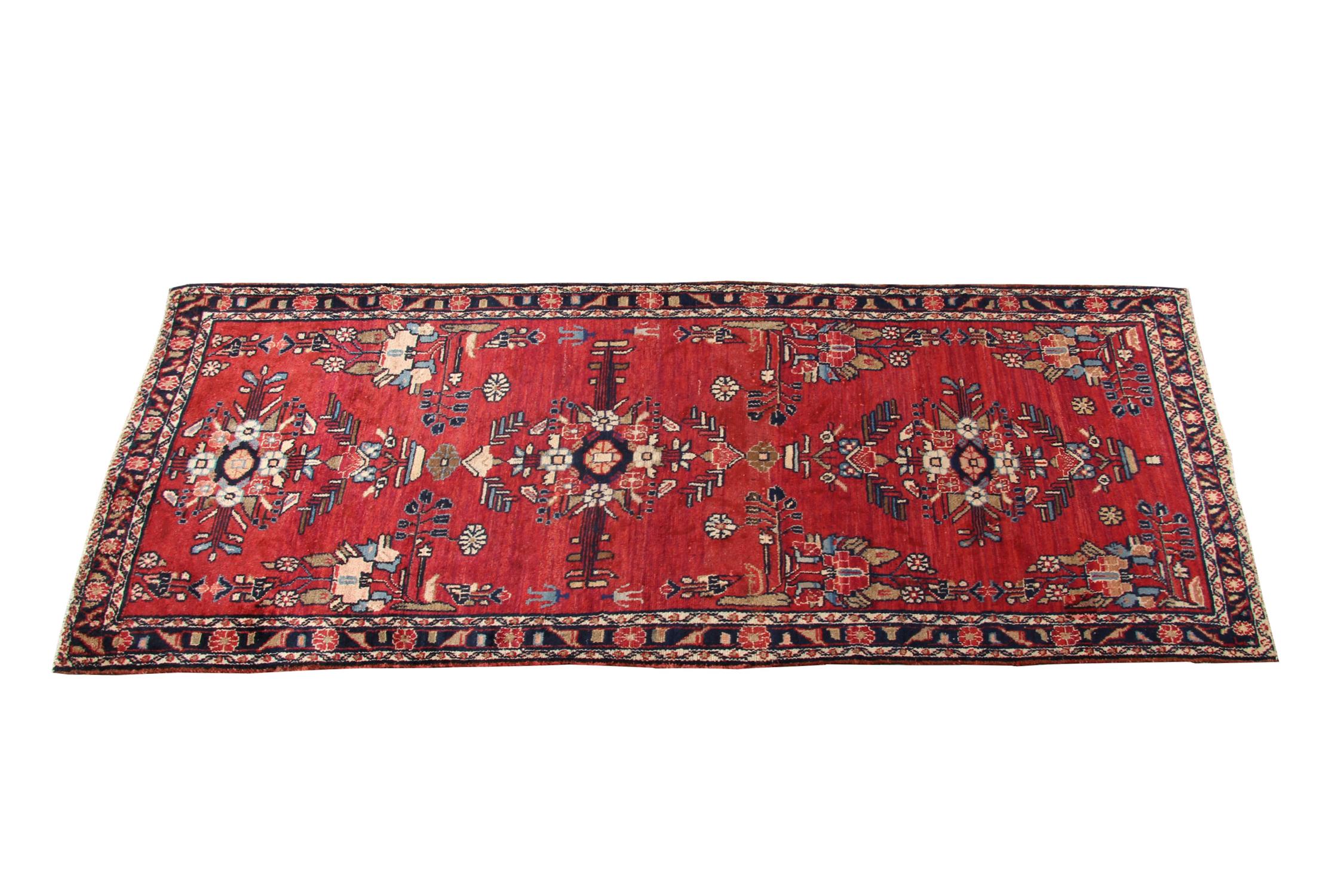 Both the colour, design and construction of this fine wool rug make it the perfect accent piece. The central design features a rich red background with an intricate tribal repeat design woven in brown, black and deep red accent colours. This is then