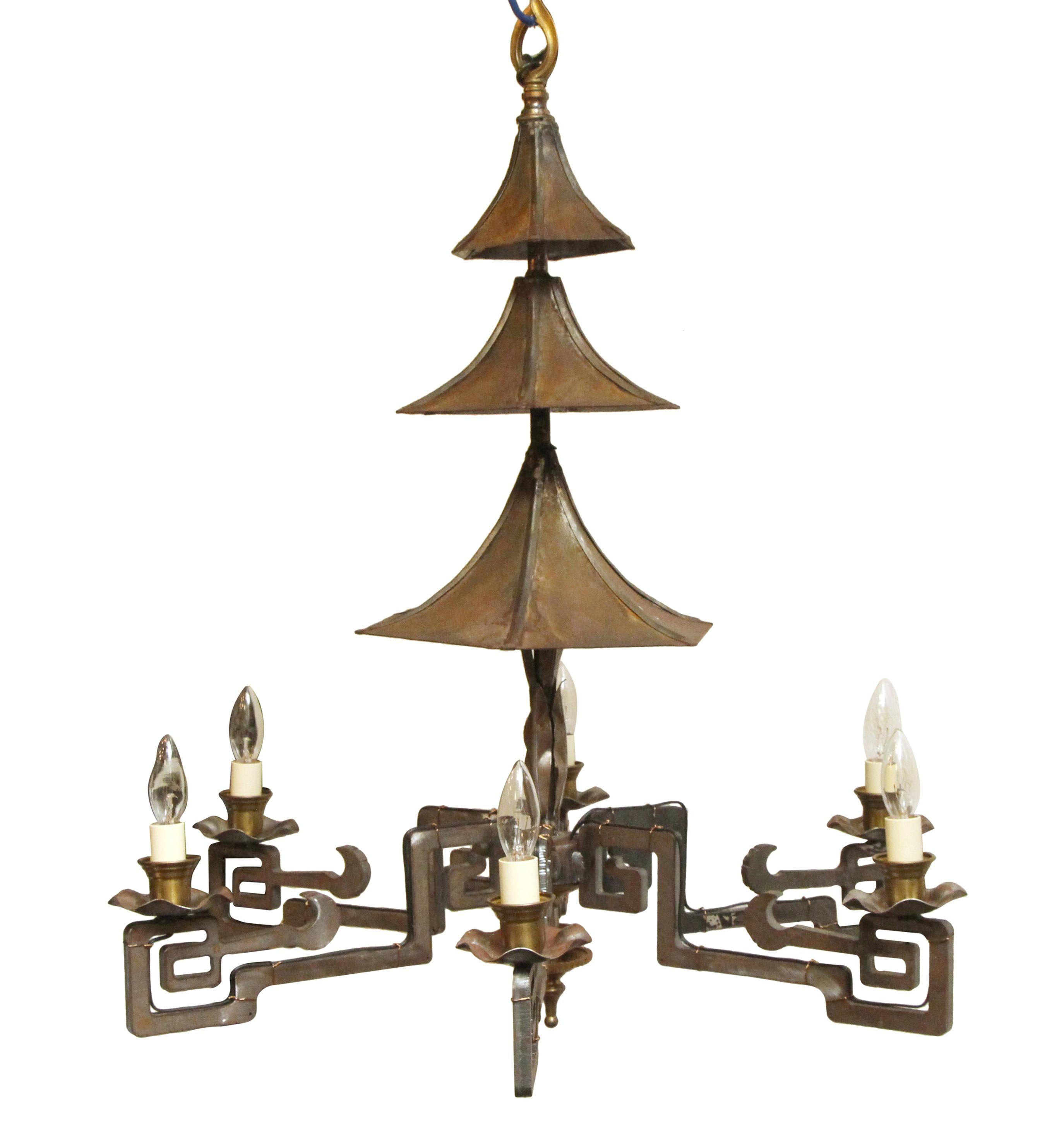 Brass and steel six-arm Chinese style chandelier with a pagoda motif. This can be seen at our 5 East 16th St location on Union Square in Manhattan.