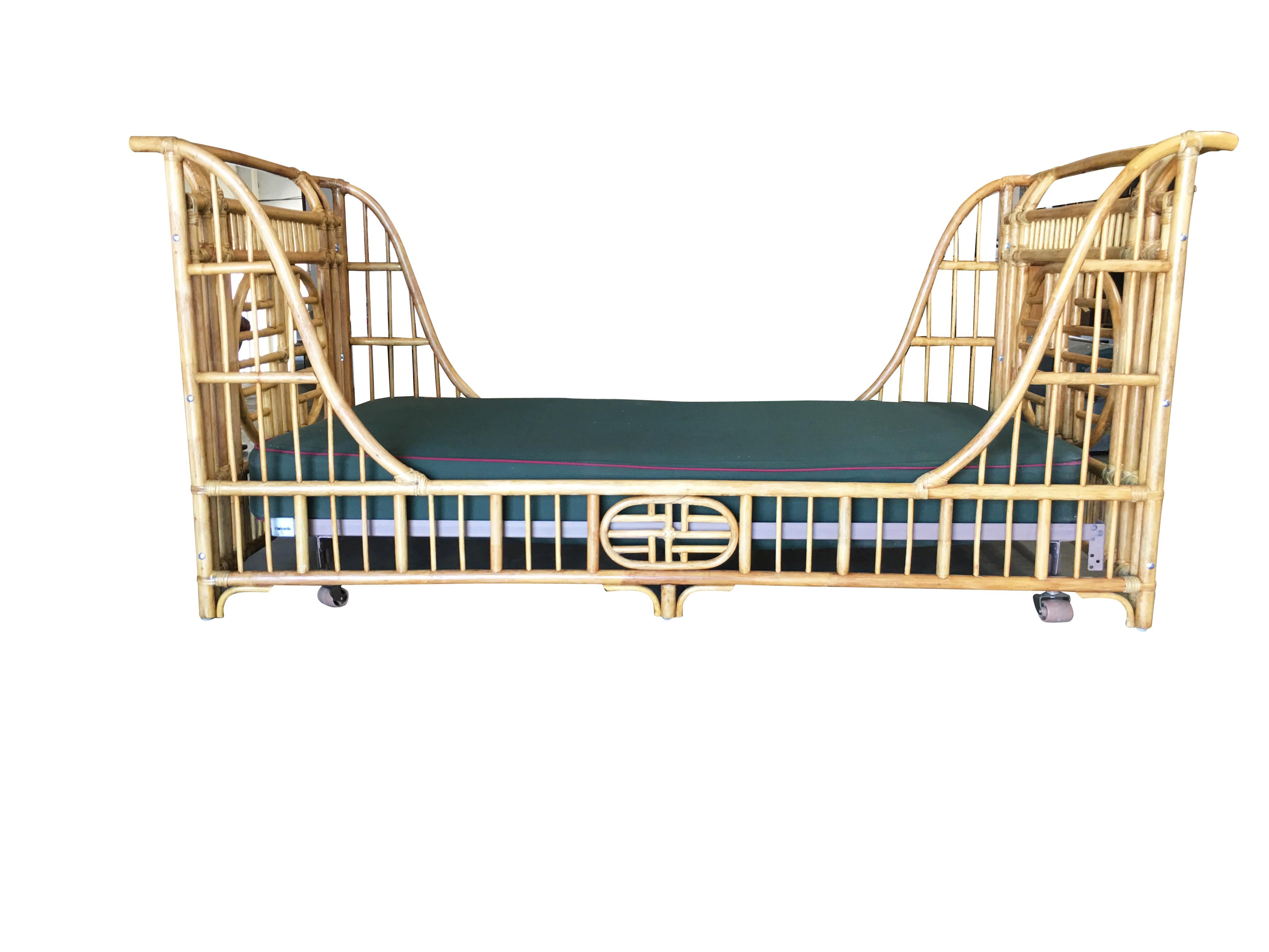 Stylish Asian style sleigh bed constructed from pole rattan. The bed features decorative Asian patterns with high arch head and foot boards. 

Inside measures 42 wide by 78 inches long which fits a twin mattress and box spring. Rattan poles accented