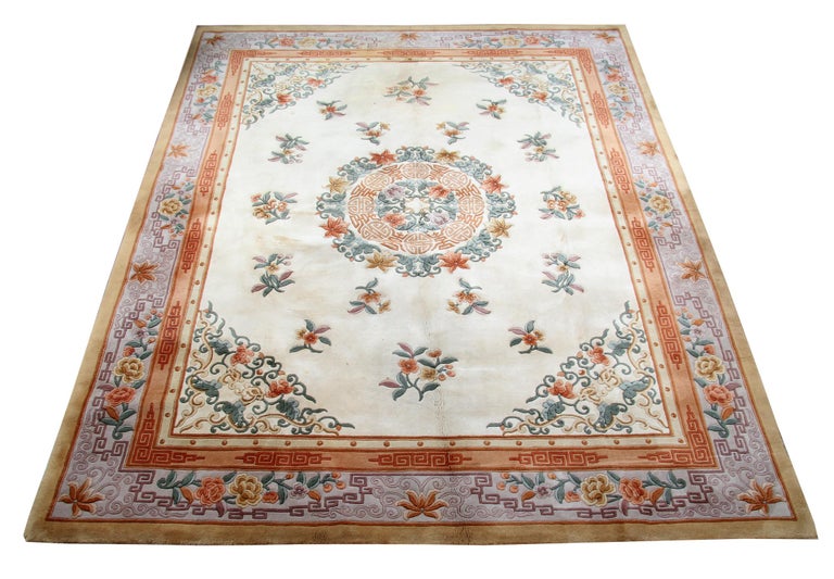 This wool rug is one of the unusual rugs of the 1970 s which are Art Deco rugs in excellent condition with a Cream background colour contrasting the stylish border and the motives. This patterned rug is a combination of a floral rug and a geometric