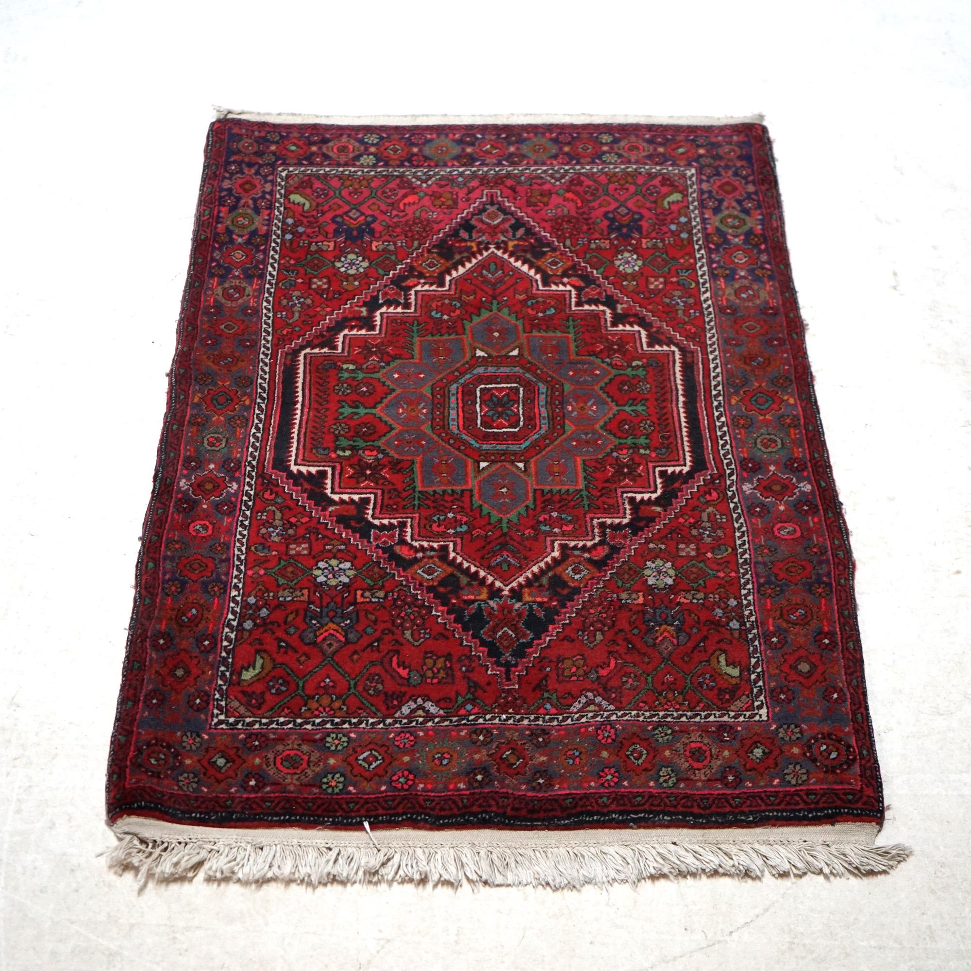 An oriental rug offers wool construction with central medallion and stylized floral and foliate elements throughout, 20th century

Measures - 49.75