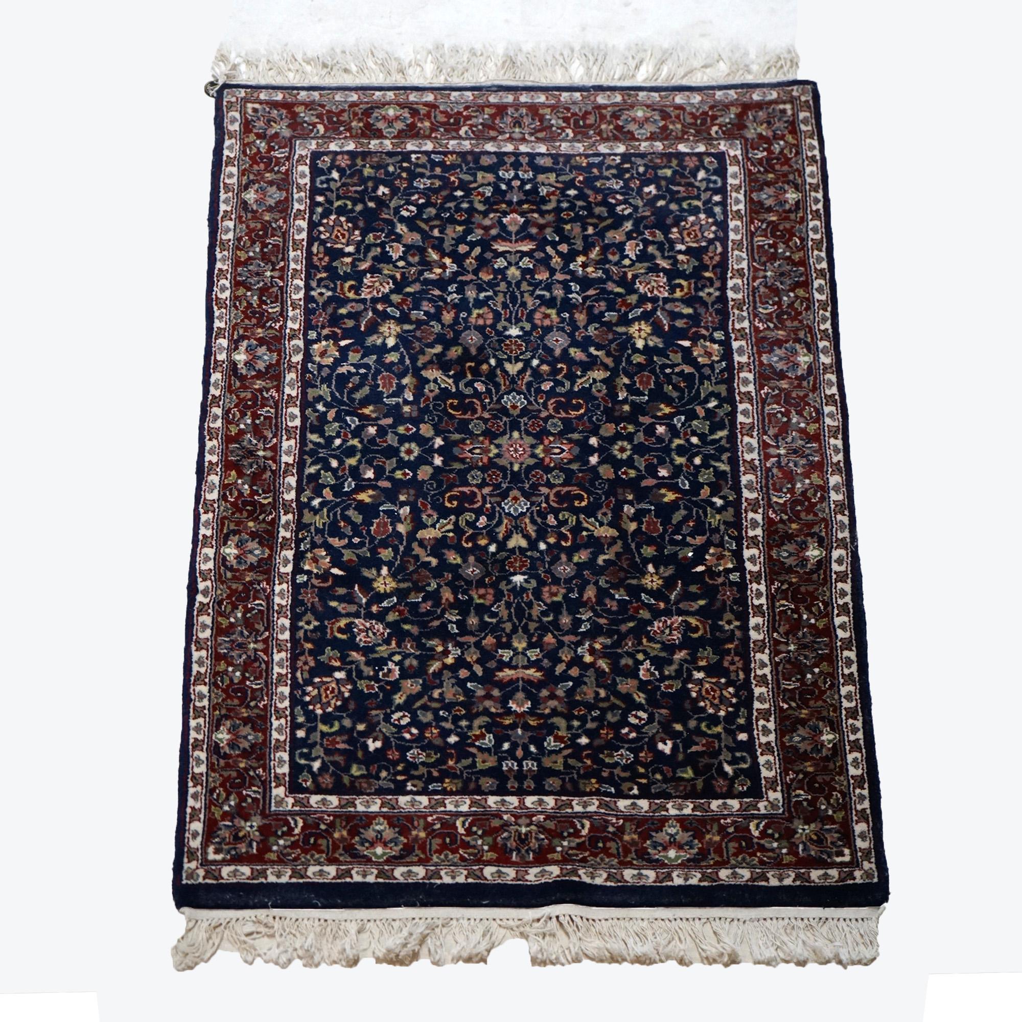 An oriental rug offers wool construction with detached floral spray throughout, 20th century

Measures - 51.25