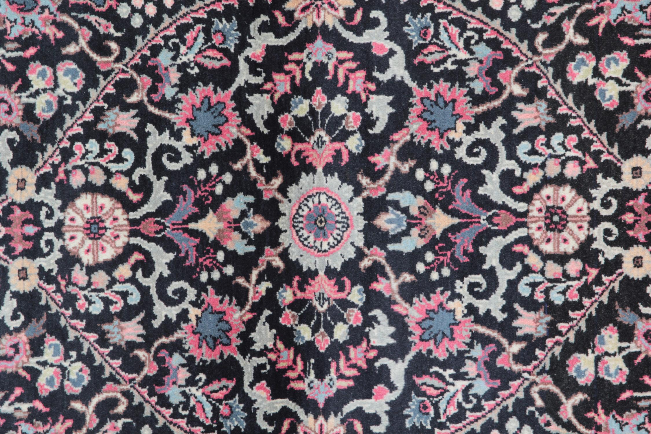 Indian carpet rugs from Punjab in a very interesting patterned rugs design. Woven with Classic colours from this period of Indian weaving, using vivid natural navy and pink. The Floral rugs are the wonderful drawing of leaves and garden and surround