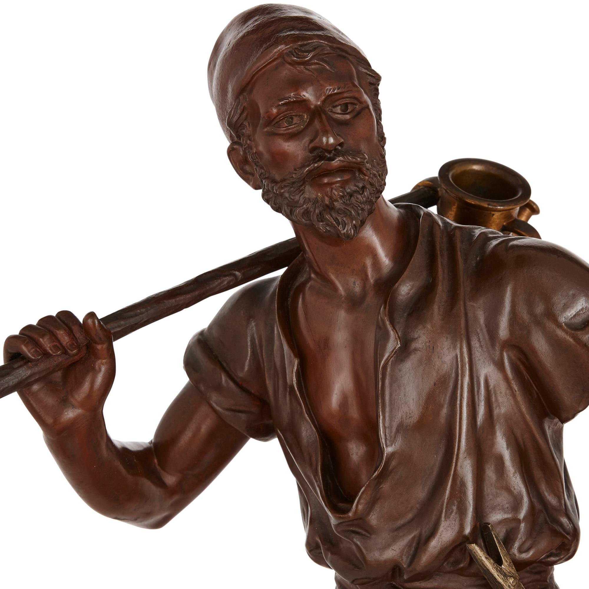 Français Figure orientaliste en bronze d'un porteur d'eau par Marcel Debut en vente
