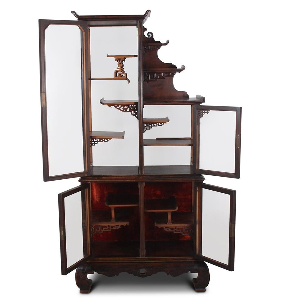 This wonderful display cabinet is designed in an Orientaliste style, which was popular in Europe in the Mid-Late 19th Century. This craze was kick-started by Japan reopening to trade with the West, and exporting Japanese goods—including furniture