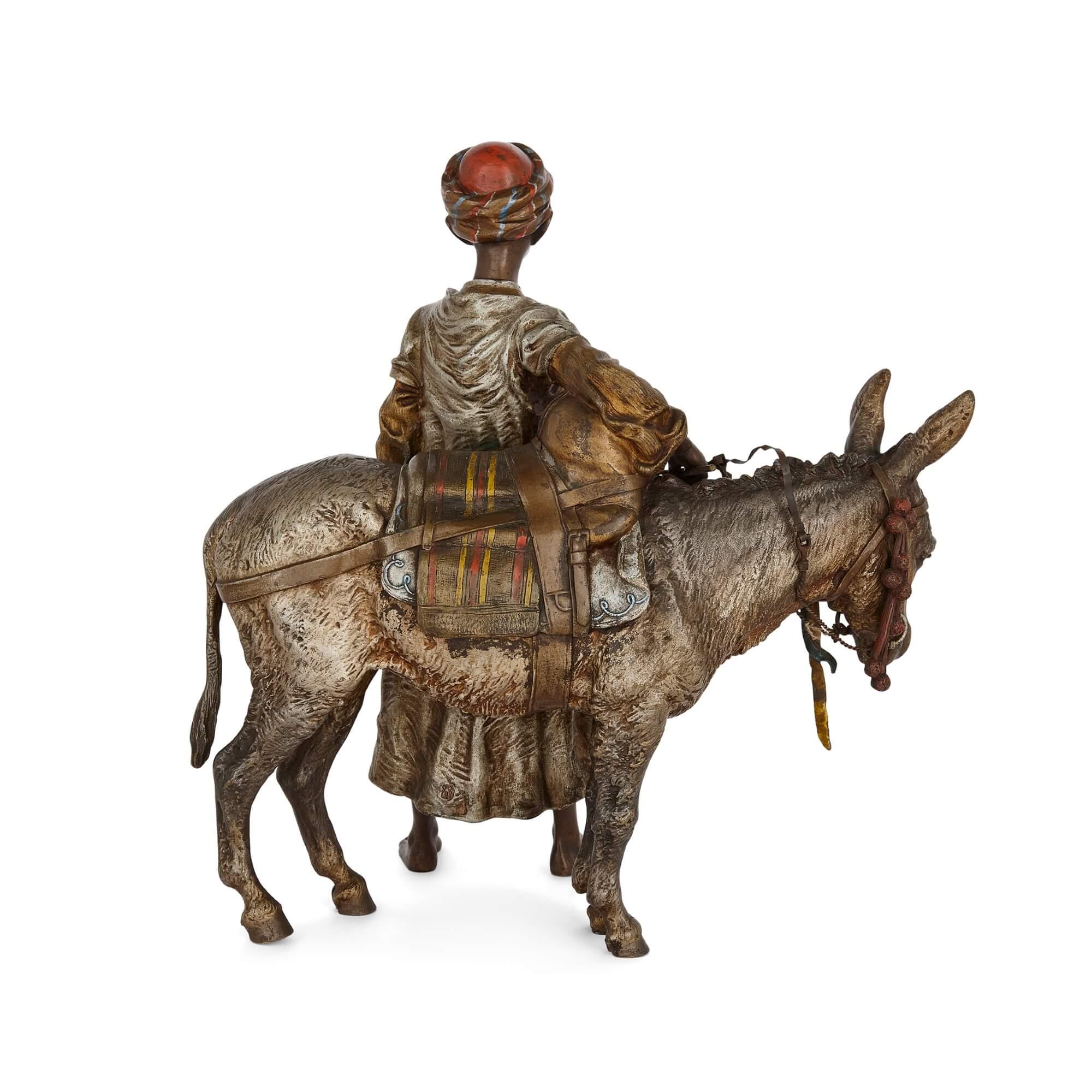 Cast Orientalist Cold-Painted Bronze Sculpture of a Boy and a Donkey by Bergman For Sale