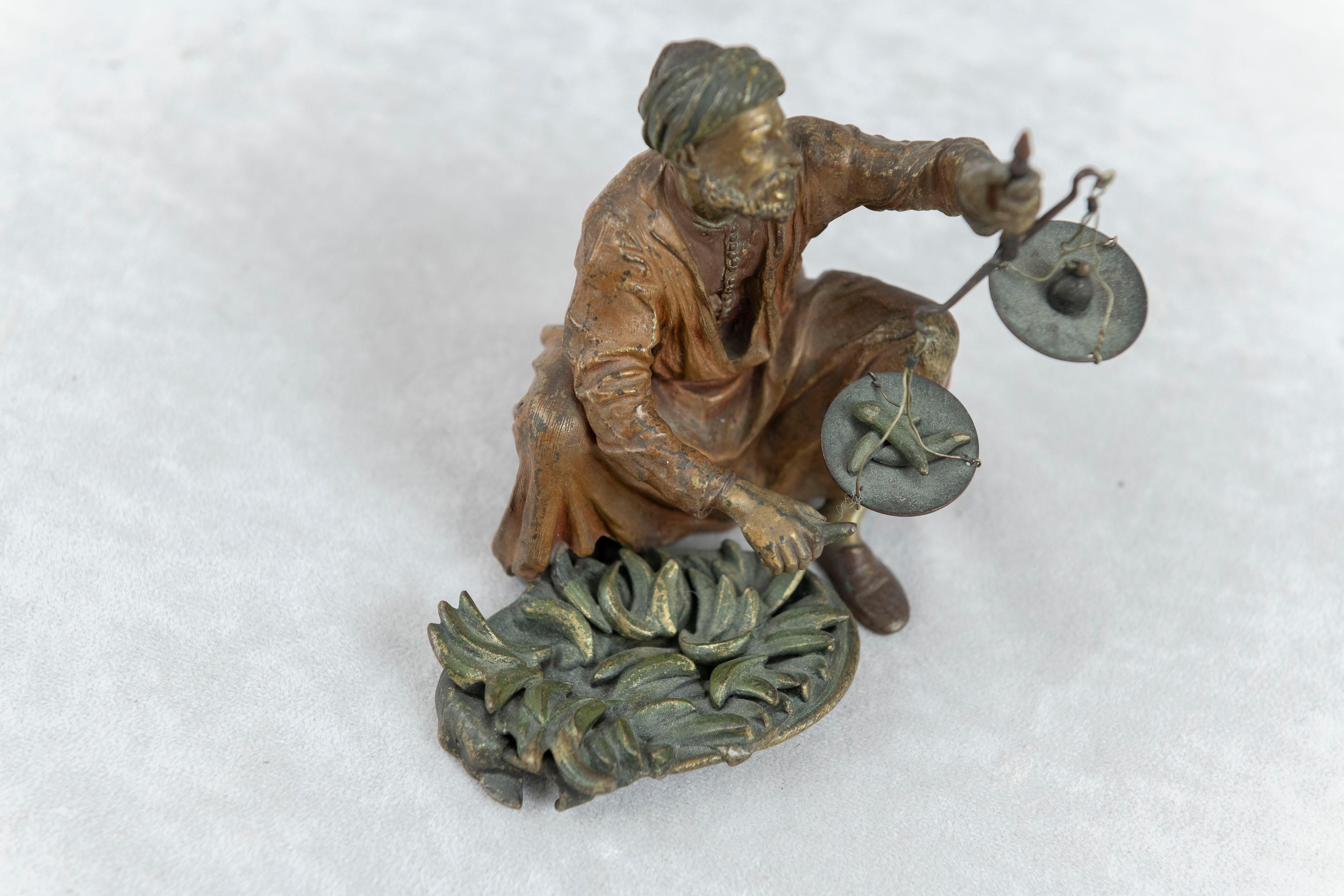 Orientalist  Cold Painted Vienna Bronze Man Holding Small Scale, Franz Bergmann In Good Condition For Sale In Petaluma, CA