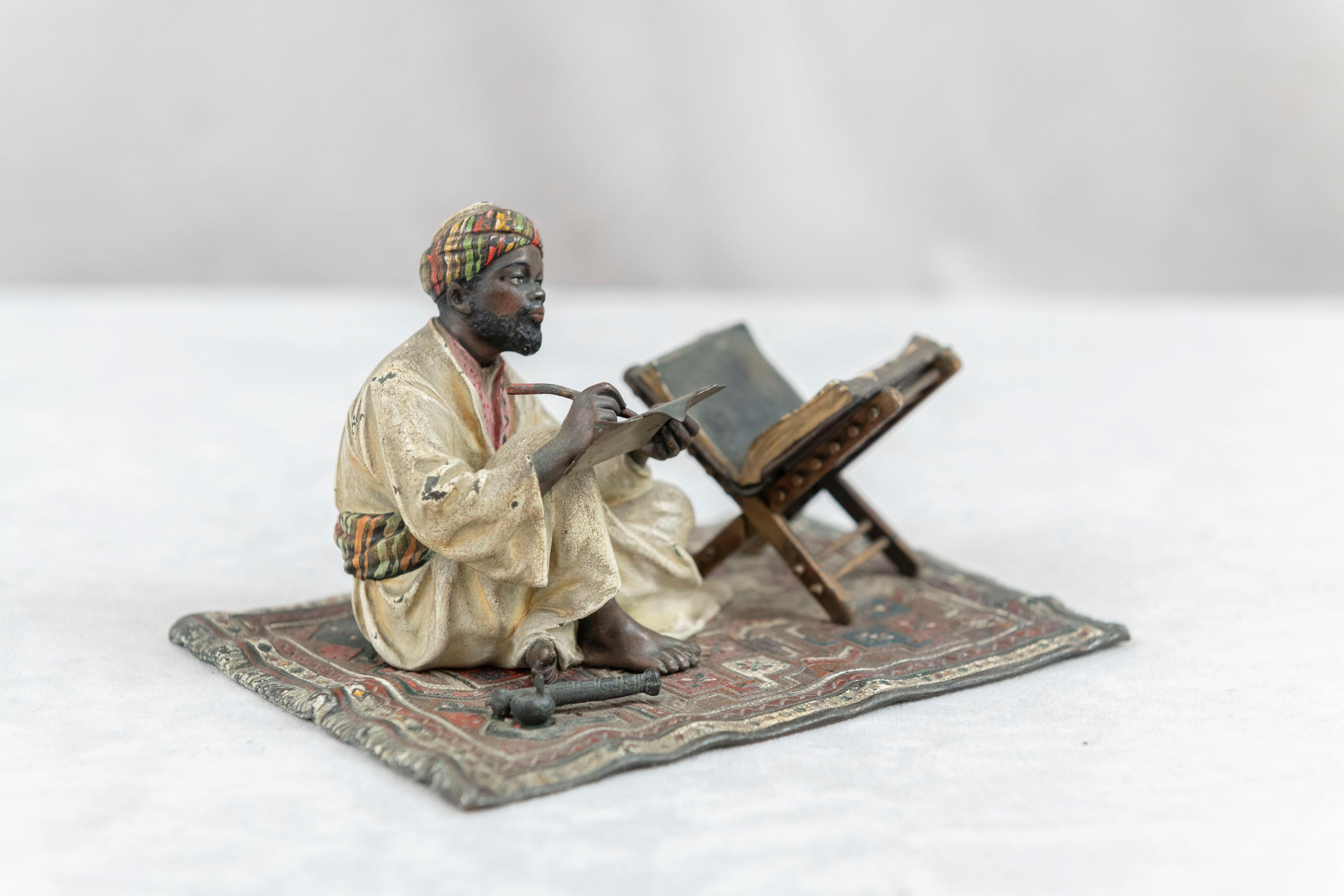 Cast Orientalist  Cold Painted Vienna Bronze Man on Rug, Writing, by Franz Bergmann For Sale