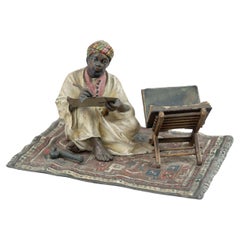 Used Orientalist  Cold Painted Vienna Bronze Man on Rug, Writing, by Franz Bergmann