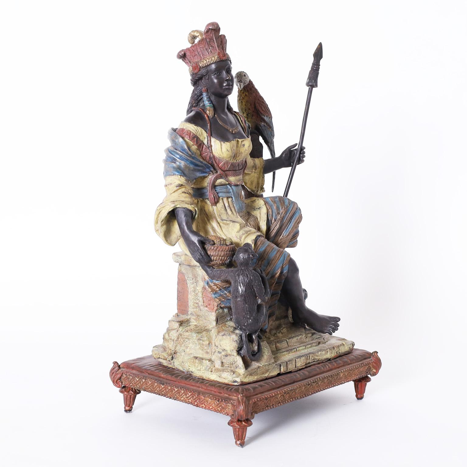 Antique orientalist bronze with an impressive composition depicting a female warrior with a spear, a parrot on a tree stump, and a monkey with a fruit bowl all with the original cold painted finish.