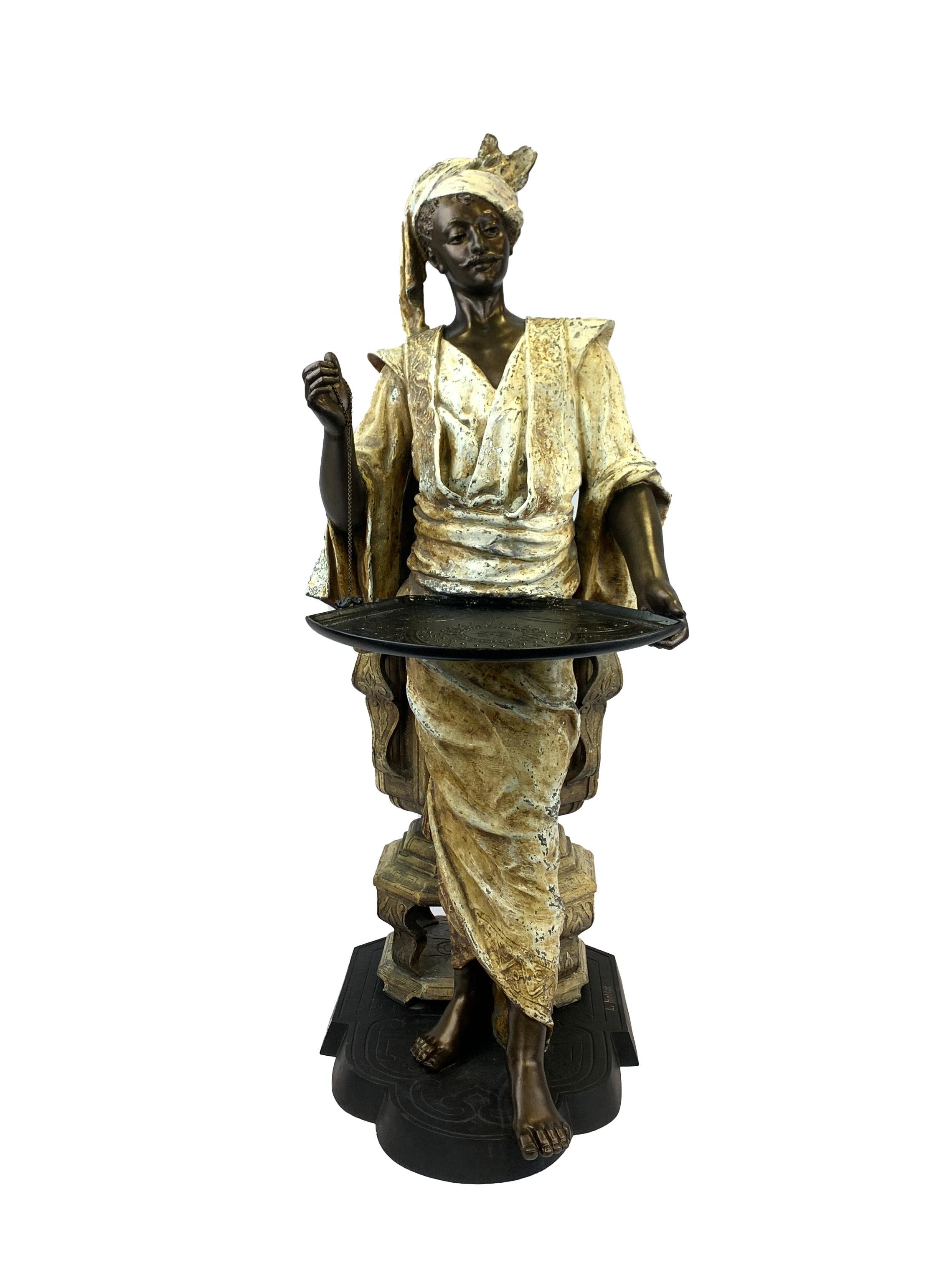 Orientalist figure standing on a shaped base before a jardinière, signed 'L. Hottot', polychrome bronze and spelter. 
  