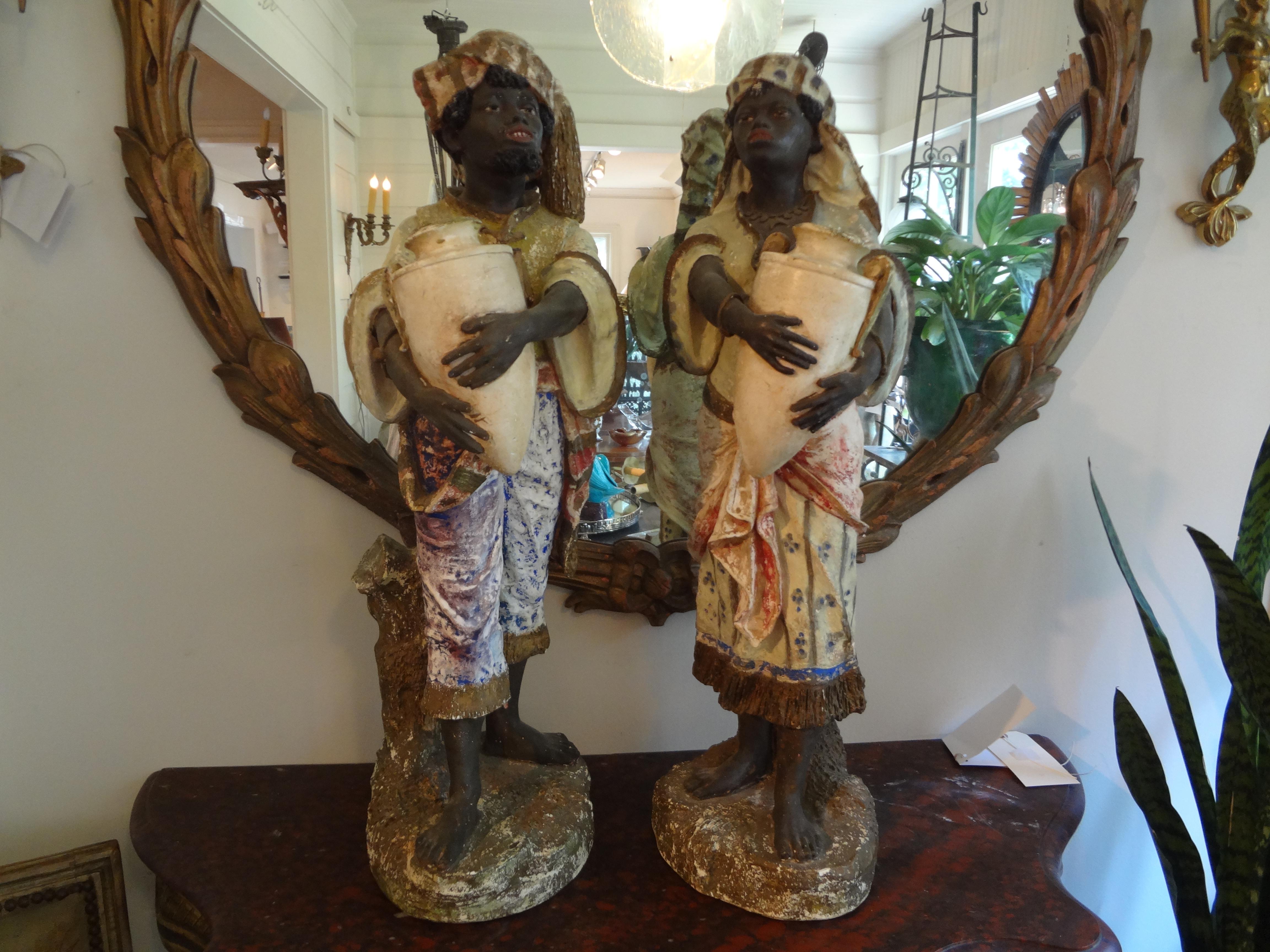 Orientalist pair of polychromed plaster arabesque figures.
Finely detailed pair of Orientalist polychromed plaster Arabesque or Moorish figures. This beautiful pair of Arabesque figures depicts a male and female in traditional Moorish clothing.