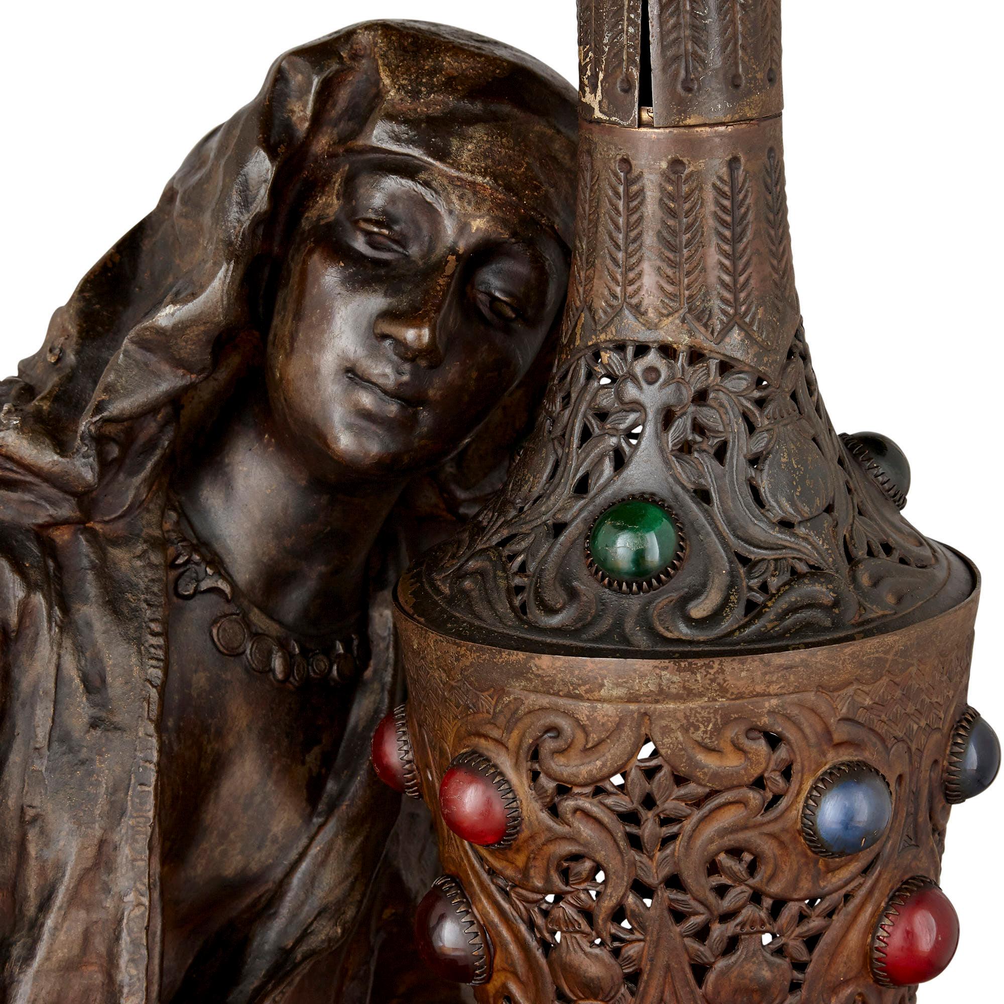 female statue holding lampshade