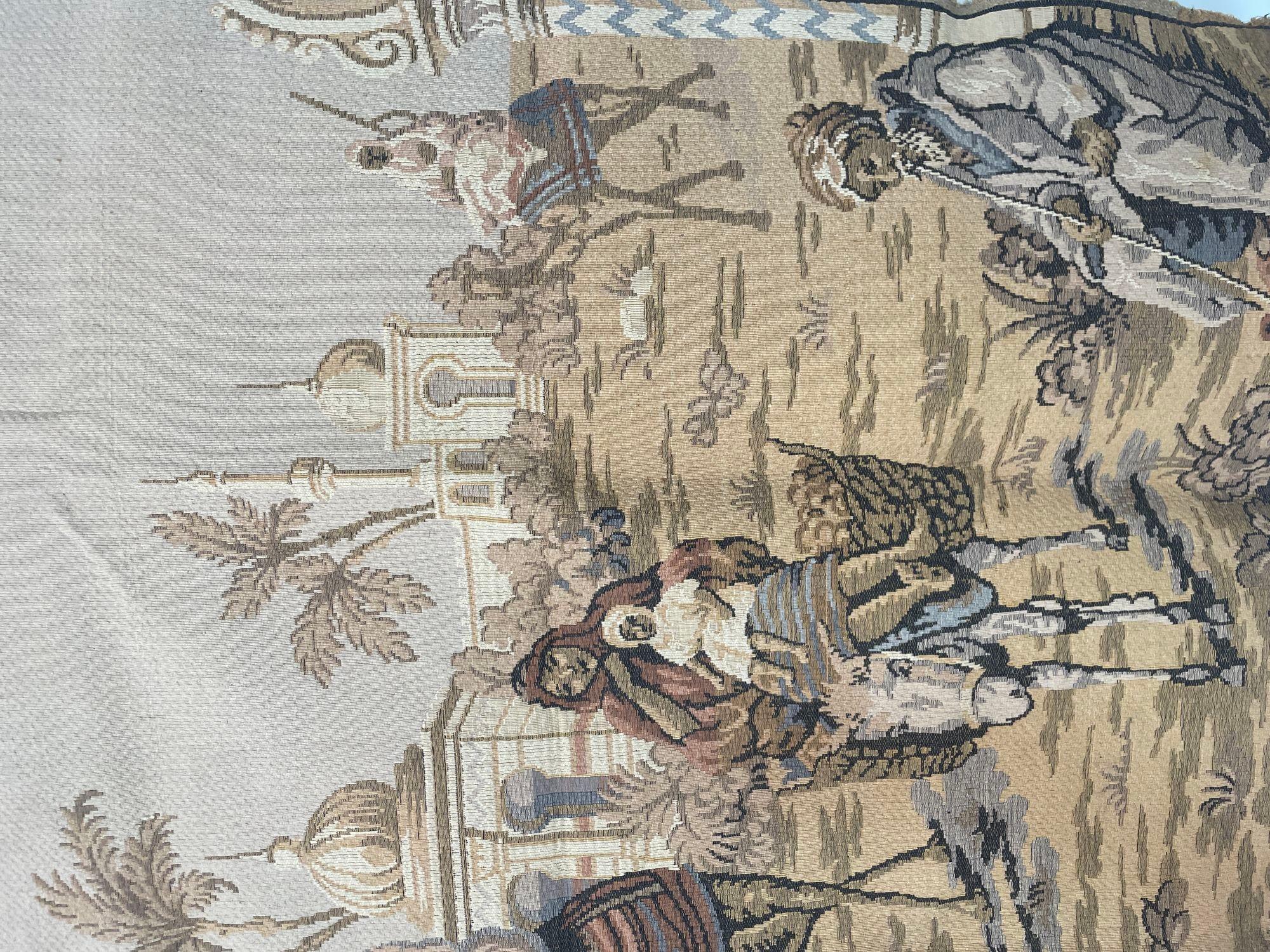 Large Aubusson style european made tapestry with an orientalist 19th century scene depicting Arabs figures and Middle Eastern Moorish architecture in the background.
Probably a scene in North Africa, Morocco or Algeria, Tunisia, Egypt with a man on