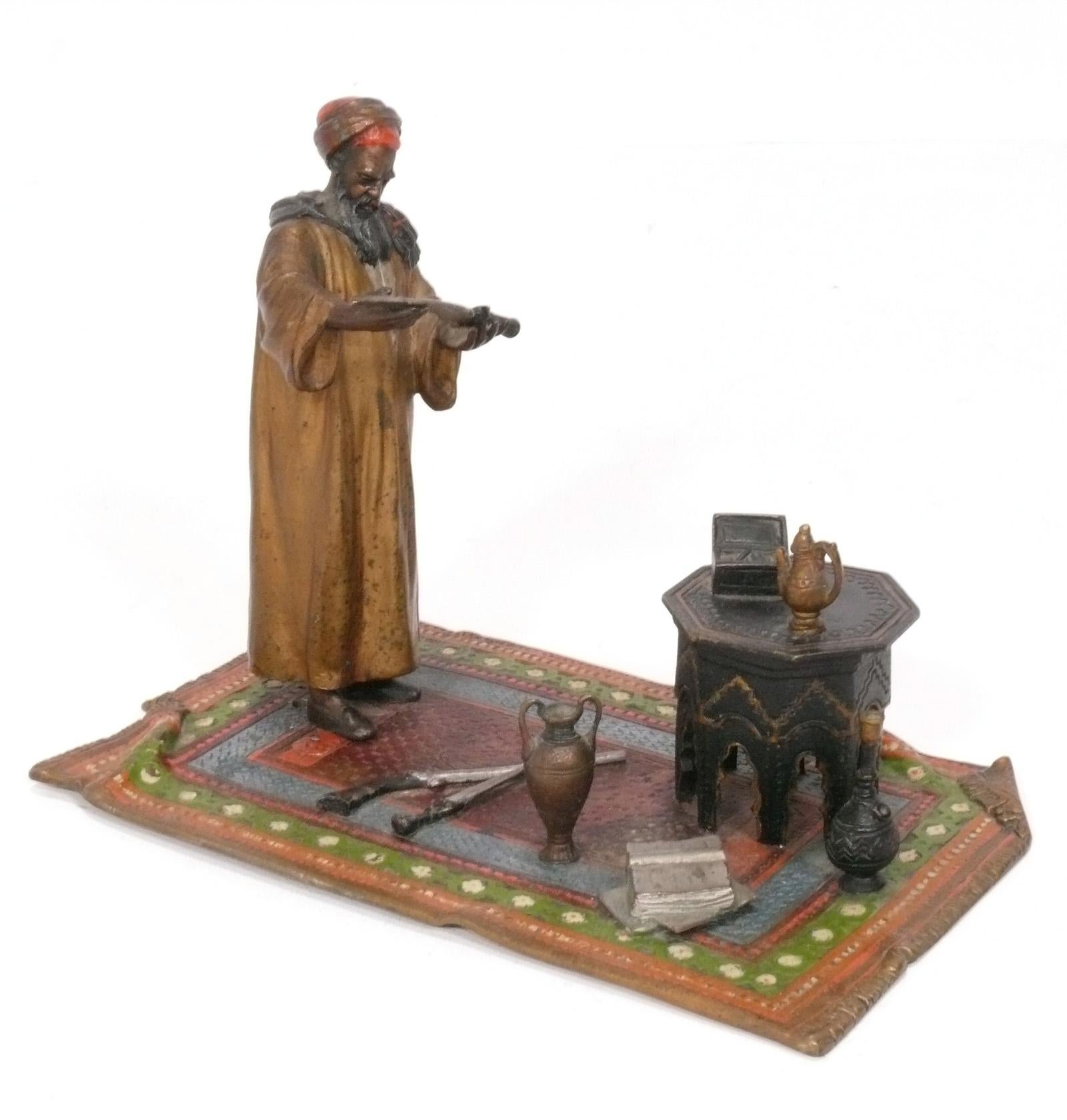 Well Made Cold Painted Orientalist Merchant Sculpture, attributed to Hans Xaver Bergman, Vienna, Austria, circa late 19th Century. It is stamped 