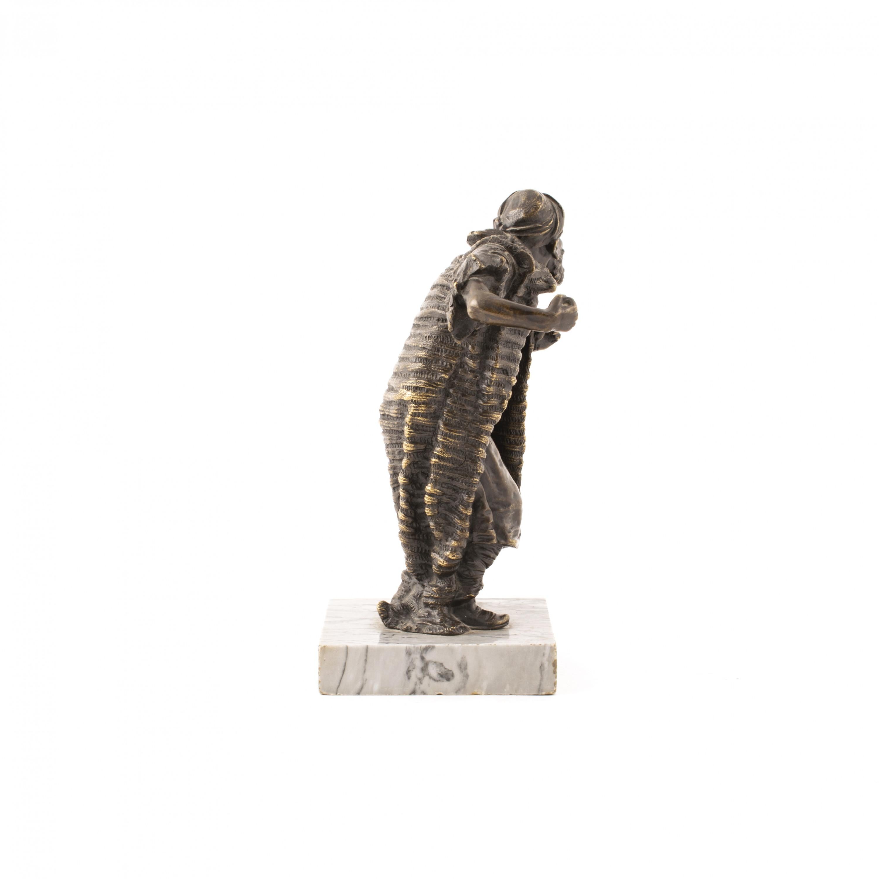 Franz Xavier Bergmann, 1861-1936.
Bronze figurine made by famous Viennese Bergmann foundry in 1900-1910, depicts an Arab merchant.
Sculpture mounted on grey marble base stamped “GESCHÜTZT” (English: PROTECTED) on the back of his garments, and