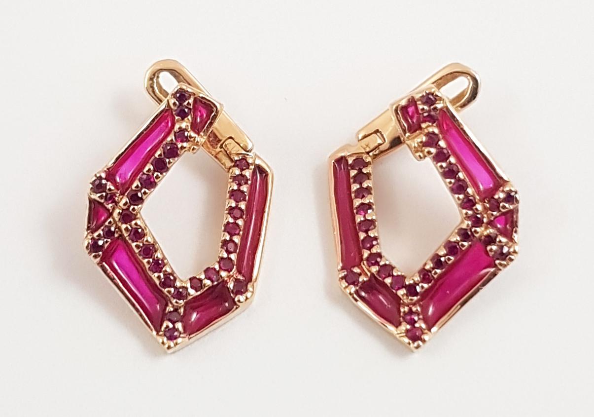 Ruby 0.36 carat Enamel Earrings 18K Rose Gold Settings

Width: 1.3 cm
Length: 1.6 cm
Weight: 3.93 grams

With merely 5 simple folds, the starting point for Link No.5 was a piece of scrap paper. The designers intentionally stopped at 5 folds for the