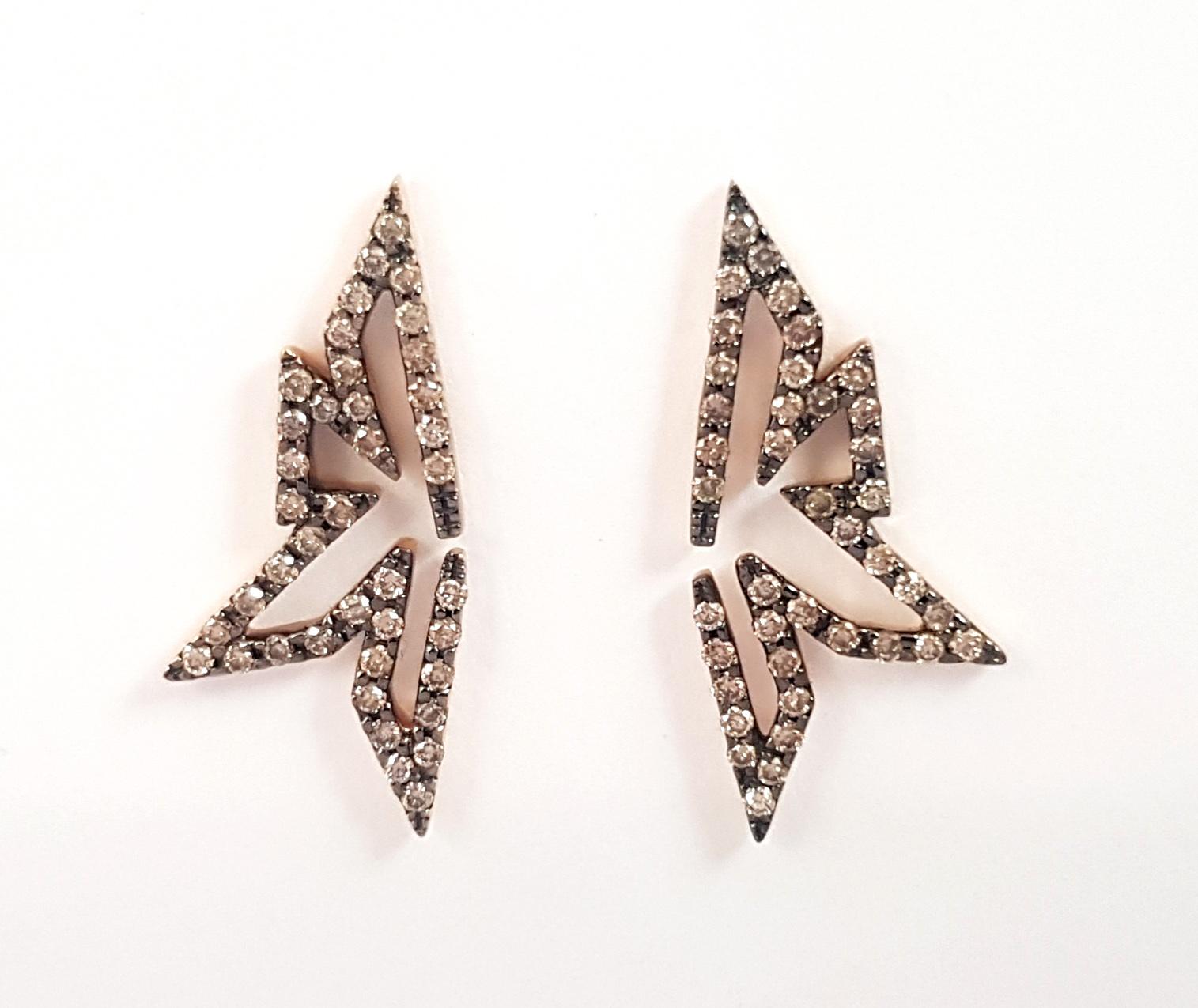Champagne Diamonds 0.60 carat Earrings set in 18K Rose Gold Settings

Width: 1.0 cm
Length: 2.5 cm
Weight: 4.62 grams

The ancient Japanese tradition of paper folding has inspired the form and elements of this modern collection. With a series of