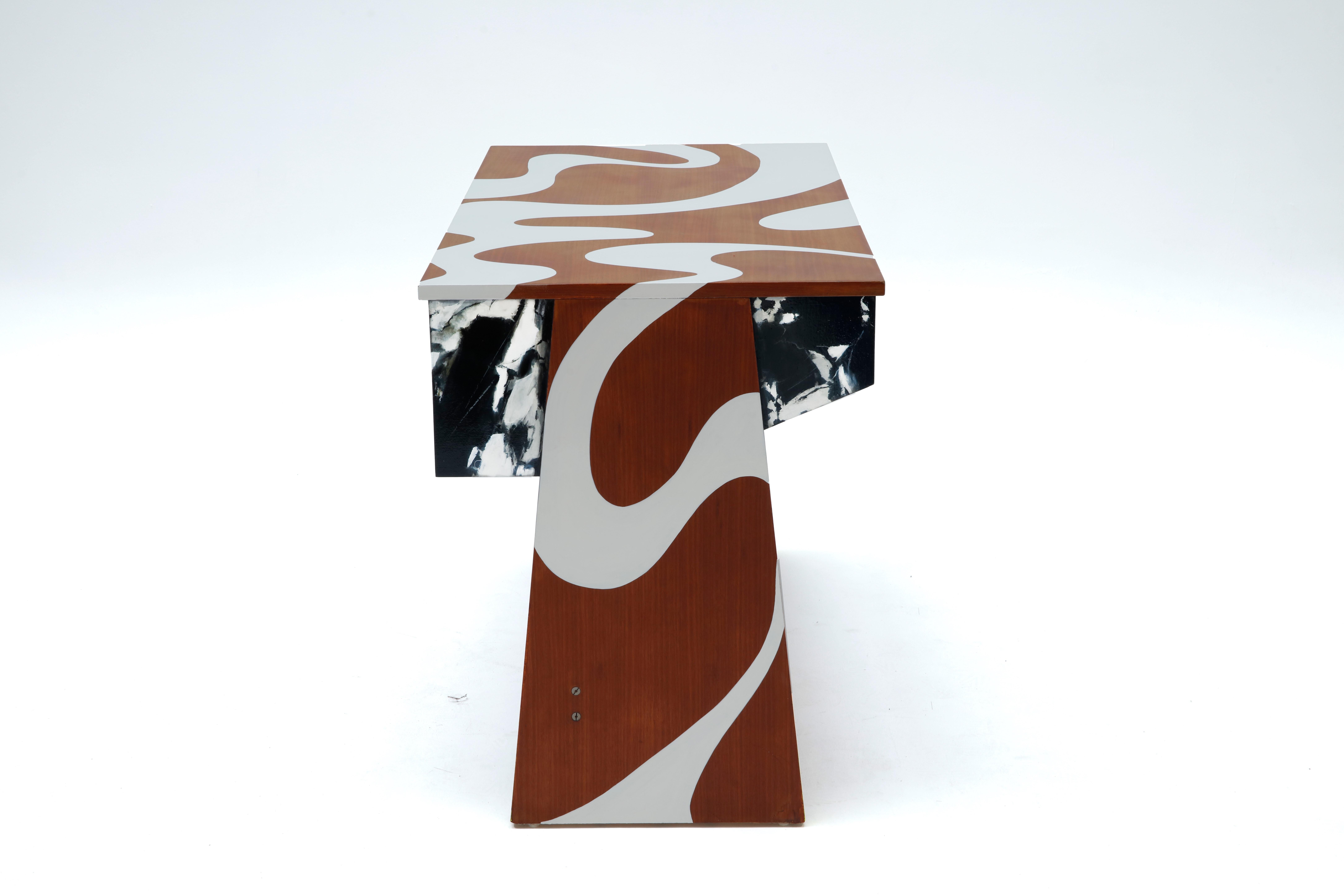 This desk is the first piece of our work, Polcha, we wanted to work the materials in trompe l'oeil and graphic forms to come, visually, destructure the original form, come to disrupt the reading of the lines. The marble gives a density that disturbs