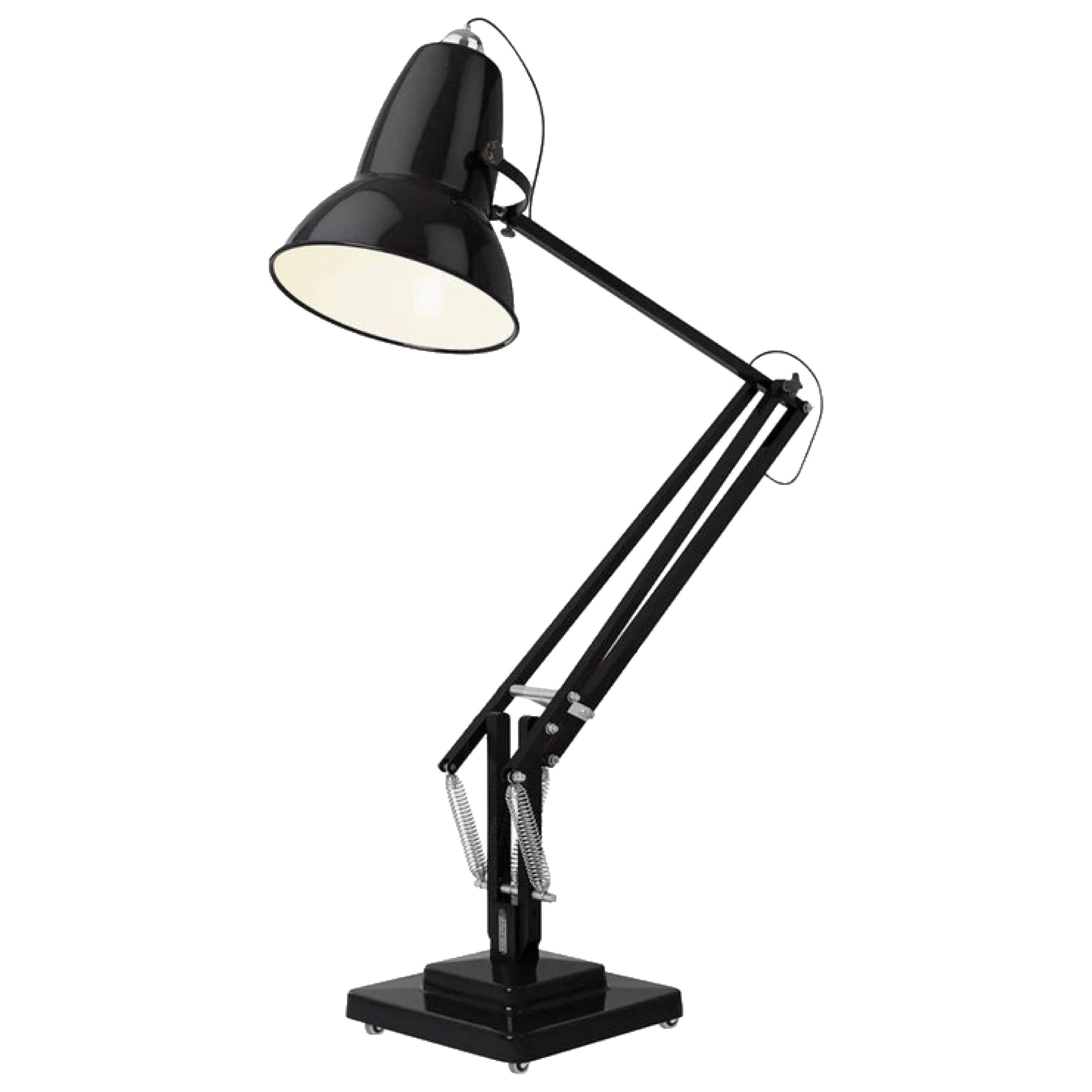 Original 1227 jet black giant floor lamp by George Carwardine for Anglepoise, UK. For years, George Carwardine worked as an automobile engineer for Horstmann Cars Limited, working on vehicle suspension systems. When the company went bankrupt in