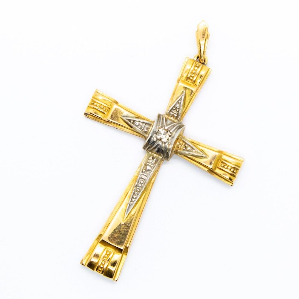 This is a unique piece of jewelry that was handmade in 18k gold and platinum.
Unique in design, this enchanting antique cross displays one single cut diamond of I-VS2 quality that weighs 0.05ctw.
Cross measure: 52mm by 30mm by 4mm
Total weight: 3.7
