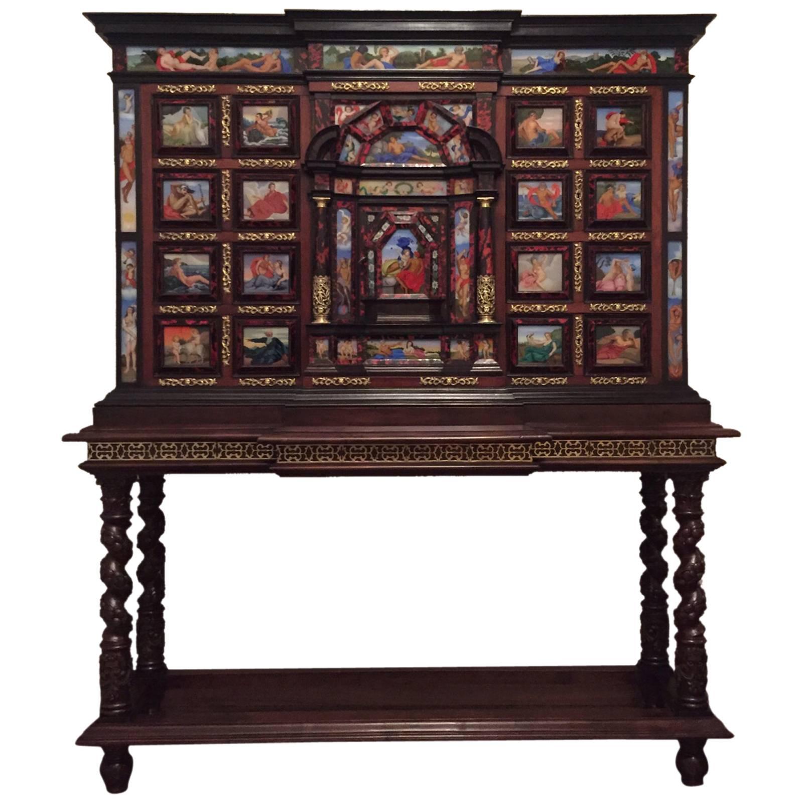 Important monumental cabinet on stand.
The case of the cabinet is walnut, veneered with rich rib boned ebony and luxuriously decorated with turtle shell, bronze, carey.
Bargueno with 49 glass paintings in bright colors, depicting gods of