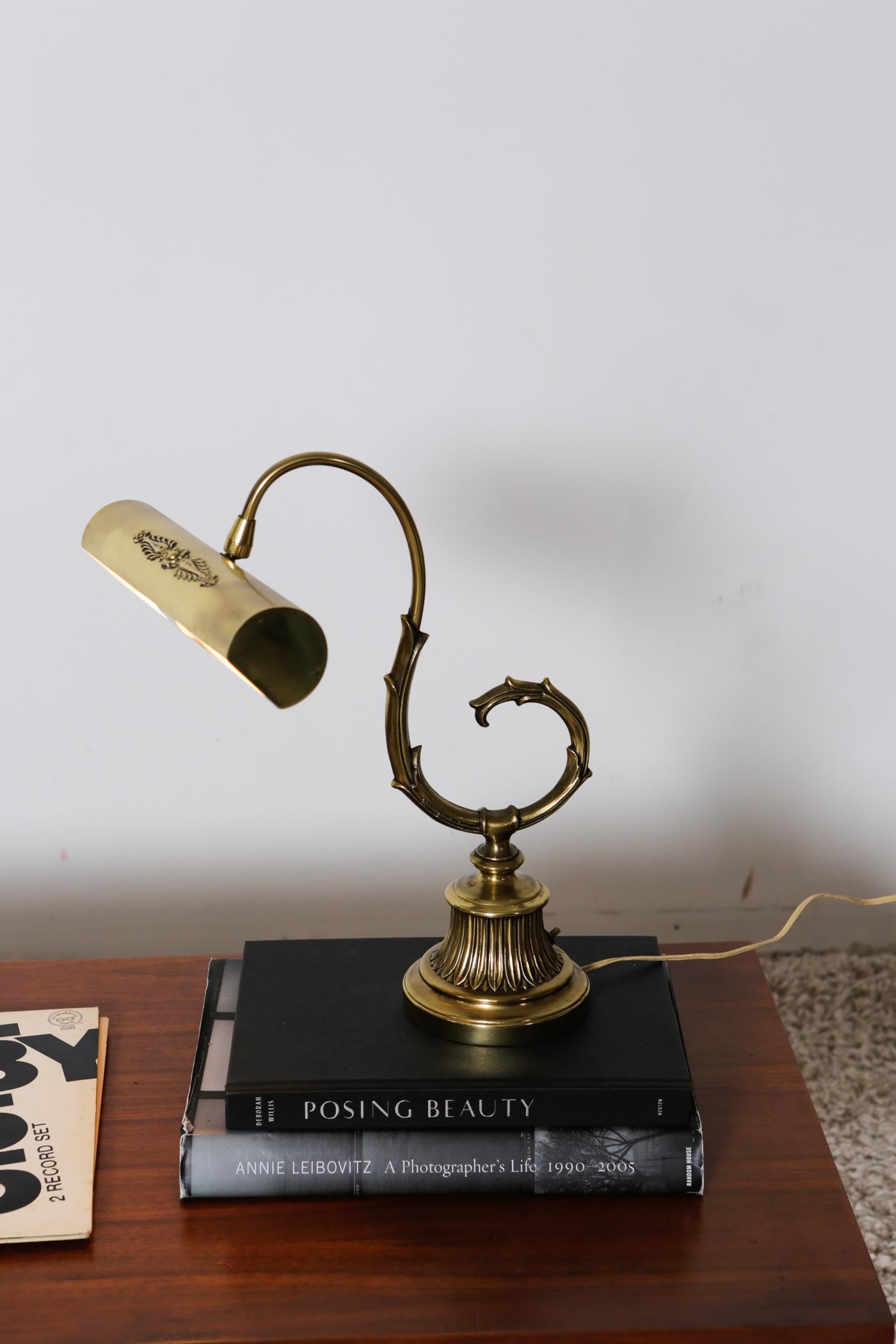 Original 1920s mid century bronze desk lamp.

This elegant but simple desk lamp stands on a heavy, sculpted bronze foot and an exquisite curved stem. The details that doesn’t exist these days.The head of the lamp is connected with a ball