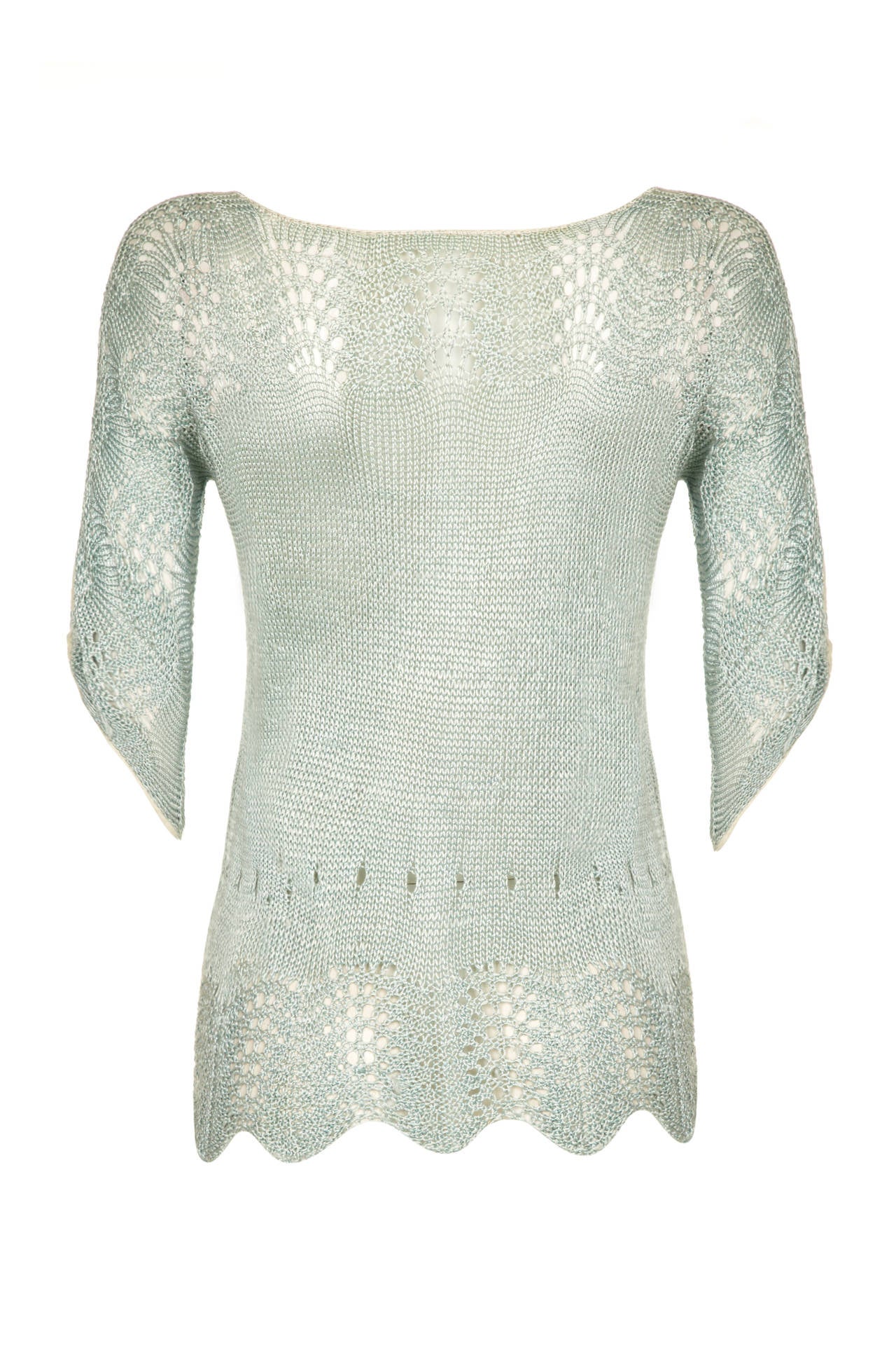 Beautiful vintage 1920s pale green fine knit and crochet mix top featuring an intricate pattern throughout and cream edging around the neckline, sleeves and cuffs. The feminine ¾ sleeves are tapered to a point at the cuff  and the hem of the piece