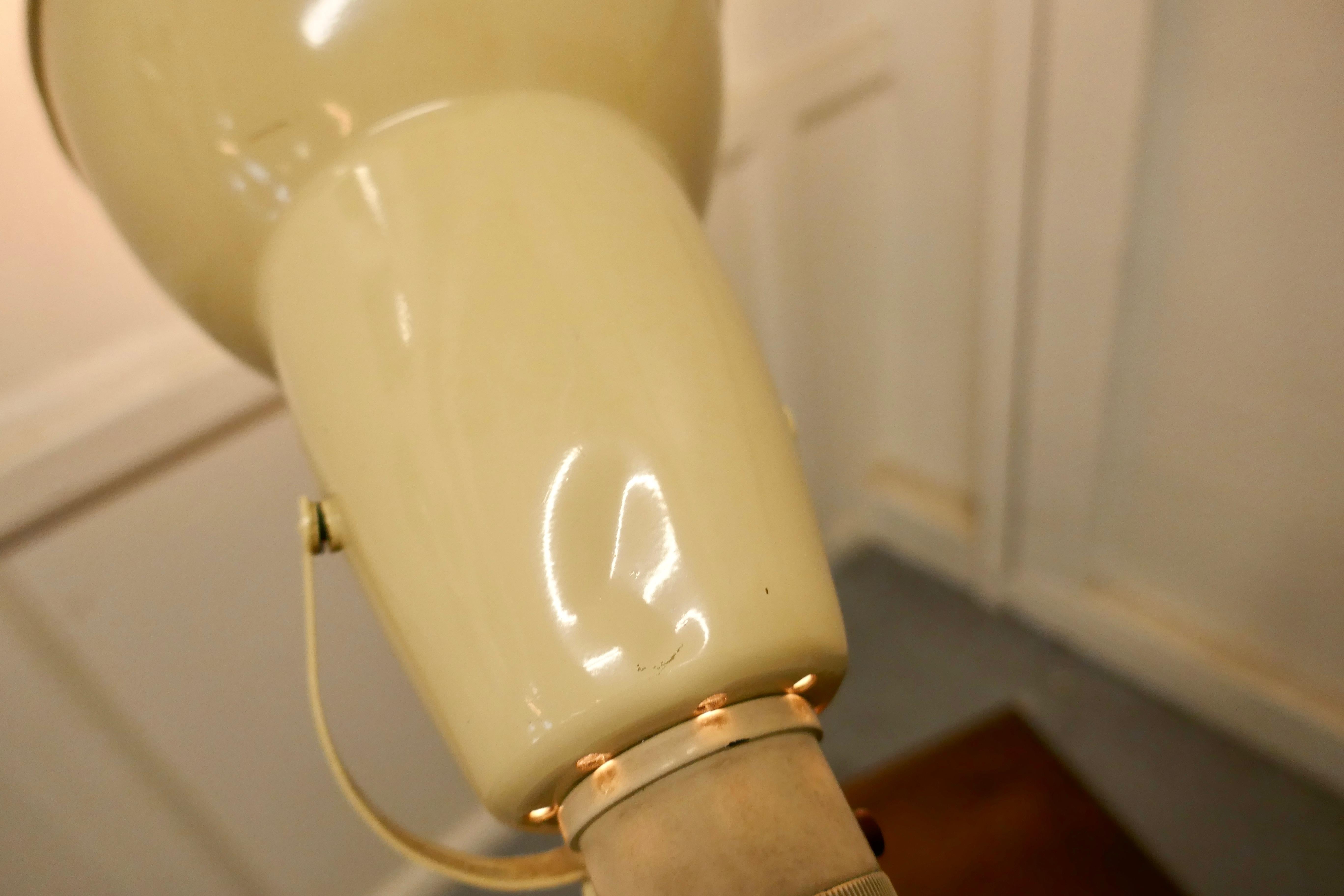 Original 1930s Anglepoise lamp.

Art Deco period early three step angle poise lamp made by Herbert Terry & Sons Redditch, the lamp is in poplar cream it is set on a square stepped base 

The condition is good with a few dents and some looseness