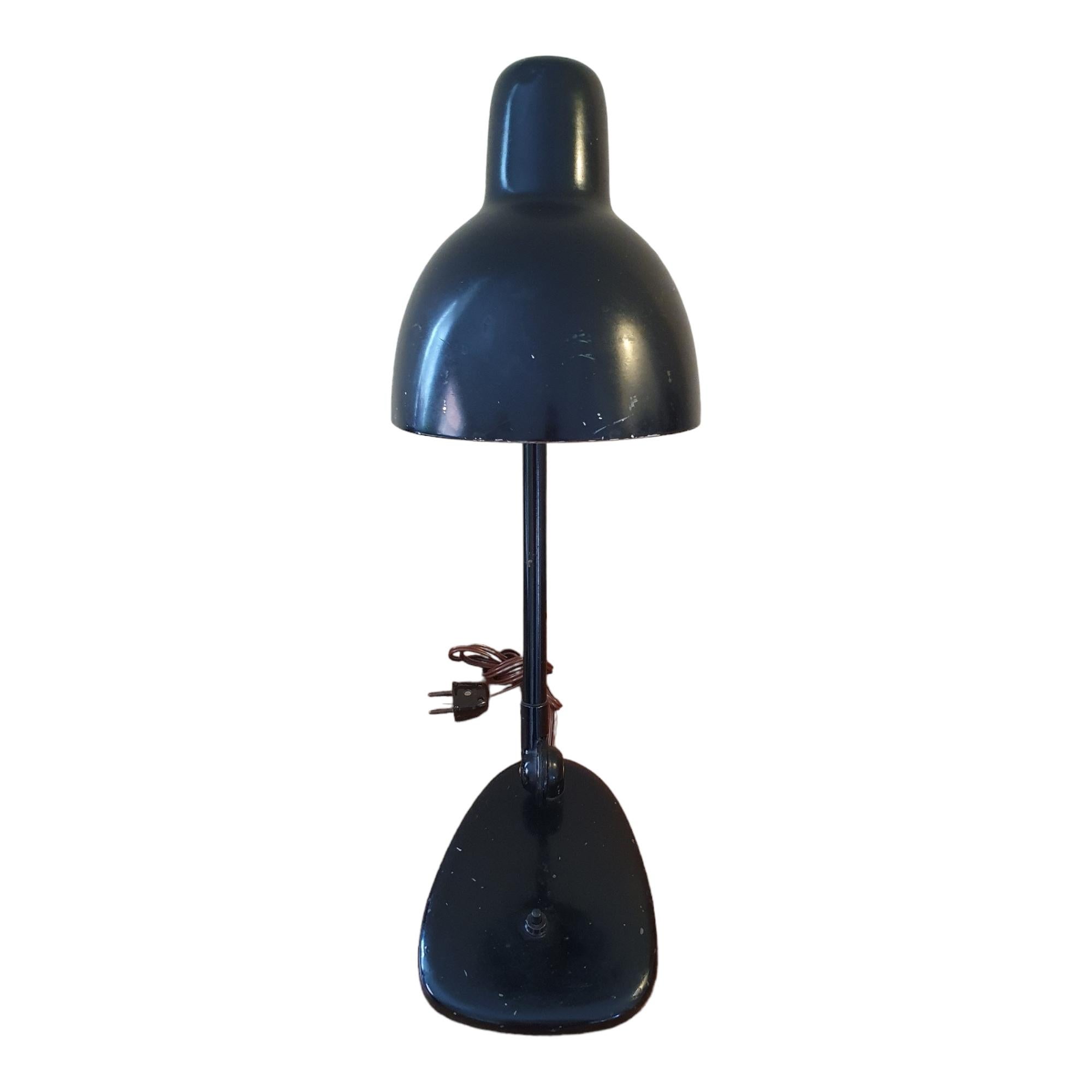 Beautiful original black Bauhaus desk / table lamp. In the style of Marianne Brandt, this lamp is a wonderful representation of the dawn of midcentury modern design reaching backwards with its raw and industrial materials and at the same time