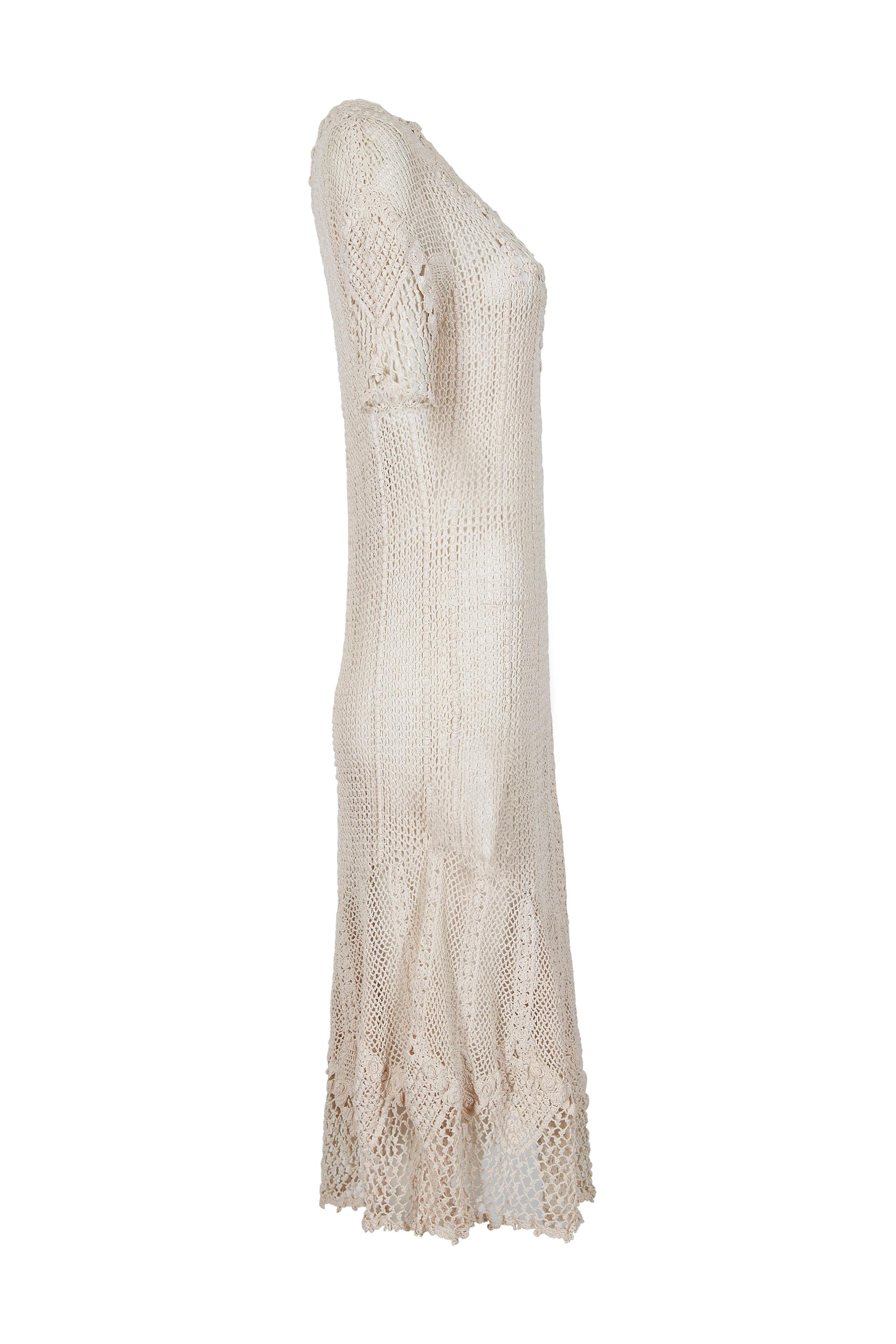 This exquisite, original 1930s hand crochet dress in ivory cream is likely of US origin and made in the Irish tradition.  It is therefore unlabelled.  It would make an enchanting choice for vintage bridal wear. The dress is ankle length with a
