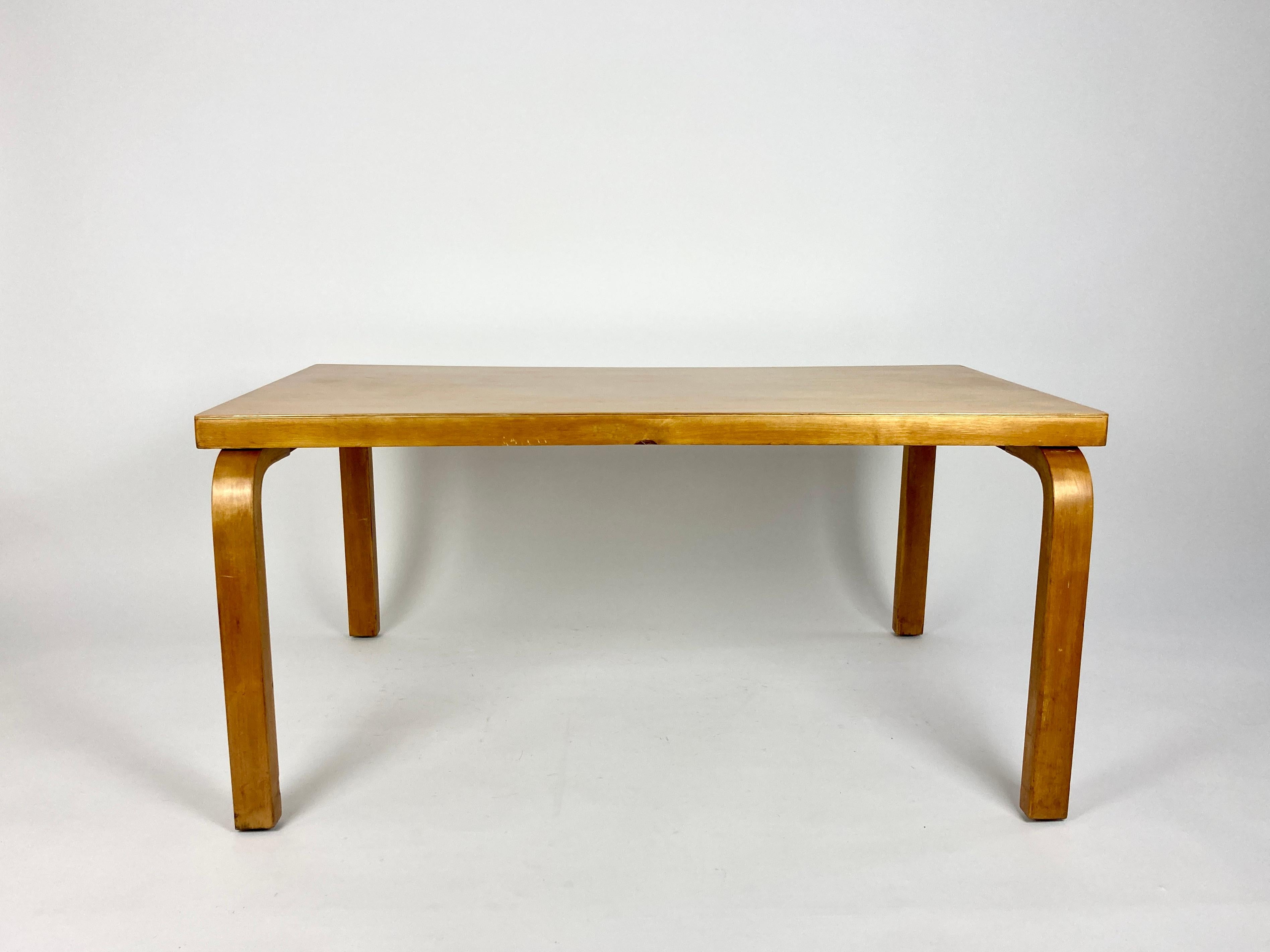 Early production low rectangular table by Alvar Aalto.

Owned by the previous owners from new, the table was in the same family since the 1930s.

Made of birch, the wood has a great golden tone. The top was refinished by the previous owners about 20
