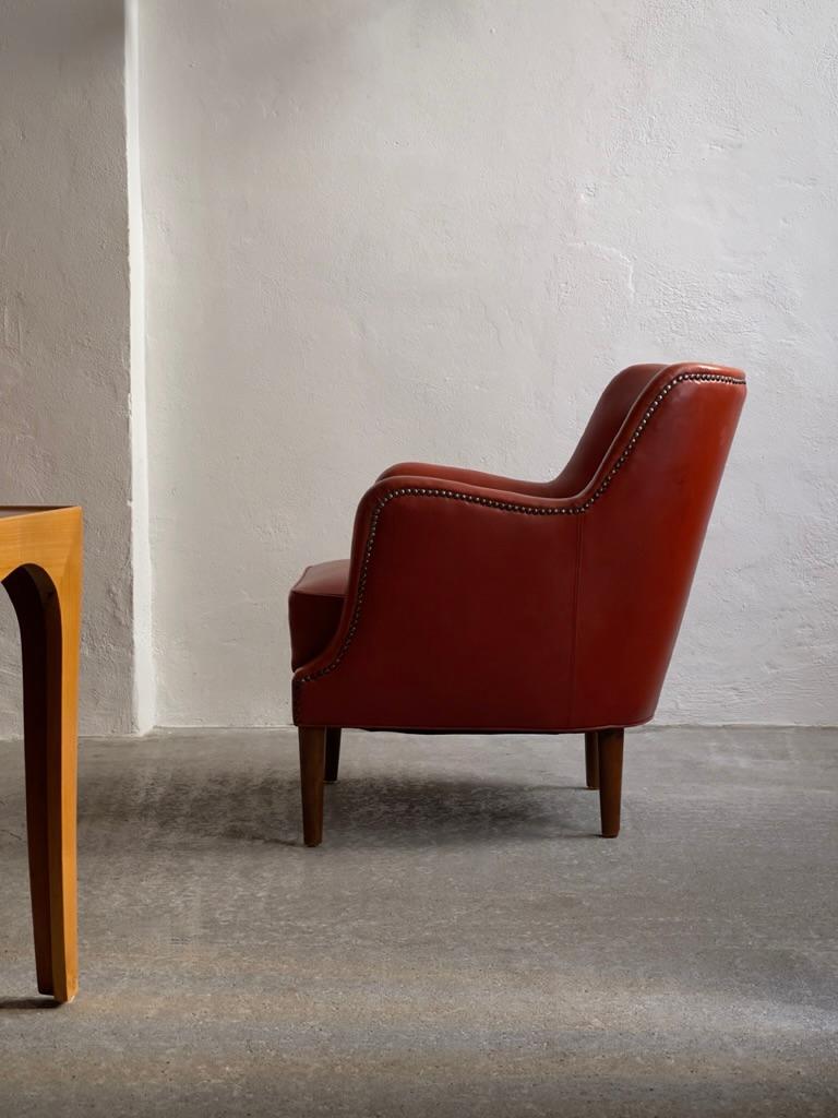 Leather Original 1940s danish modern easy chair in patinated leather with brass nails. For Sale