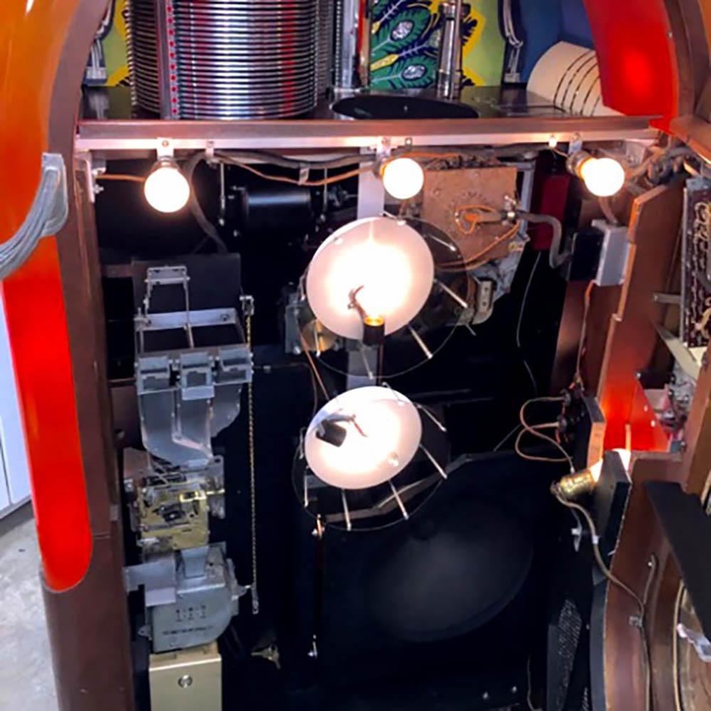 A rare bird indeed!

Known more for its nickname of ‘Peacock’ than it was for its model number, the 1941 Wurlitzer 850 is such a rare bird that no manual for it was ever published. 

The ‘Peacock’ was the first jukebox to utilise polaroid film in