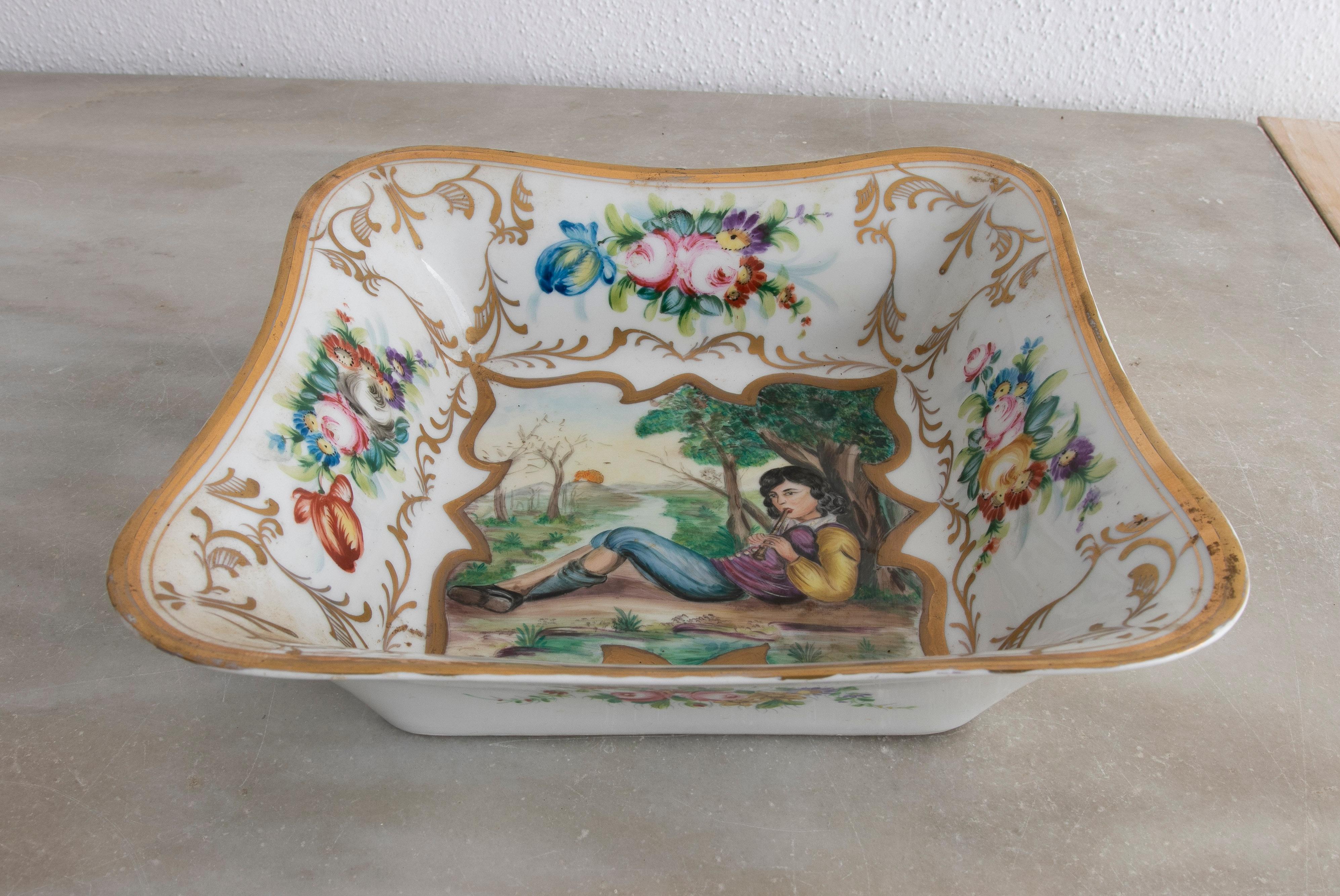 Original 1950s German Meissen stamped porcelain painted tray with boy playing the flute vignette and typical flower decorations.