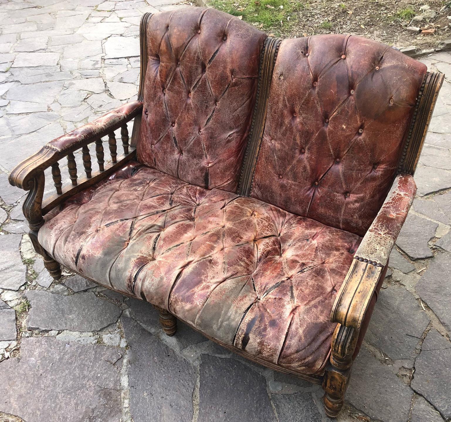 Italian sofa from 1950, original, in two-seater brown leather, with buttons and stitching. 
The structure is in beech. 
To prove the authenticity, no drastic intervention was done, only cleaning.
 Until recently it was on the veranda of a
