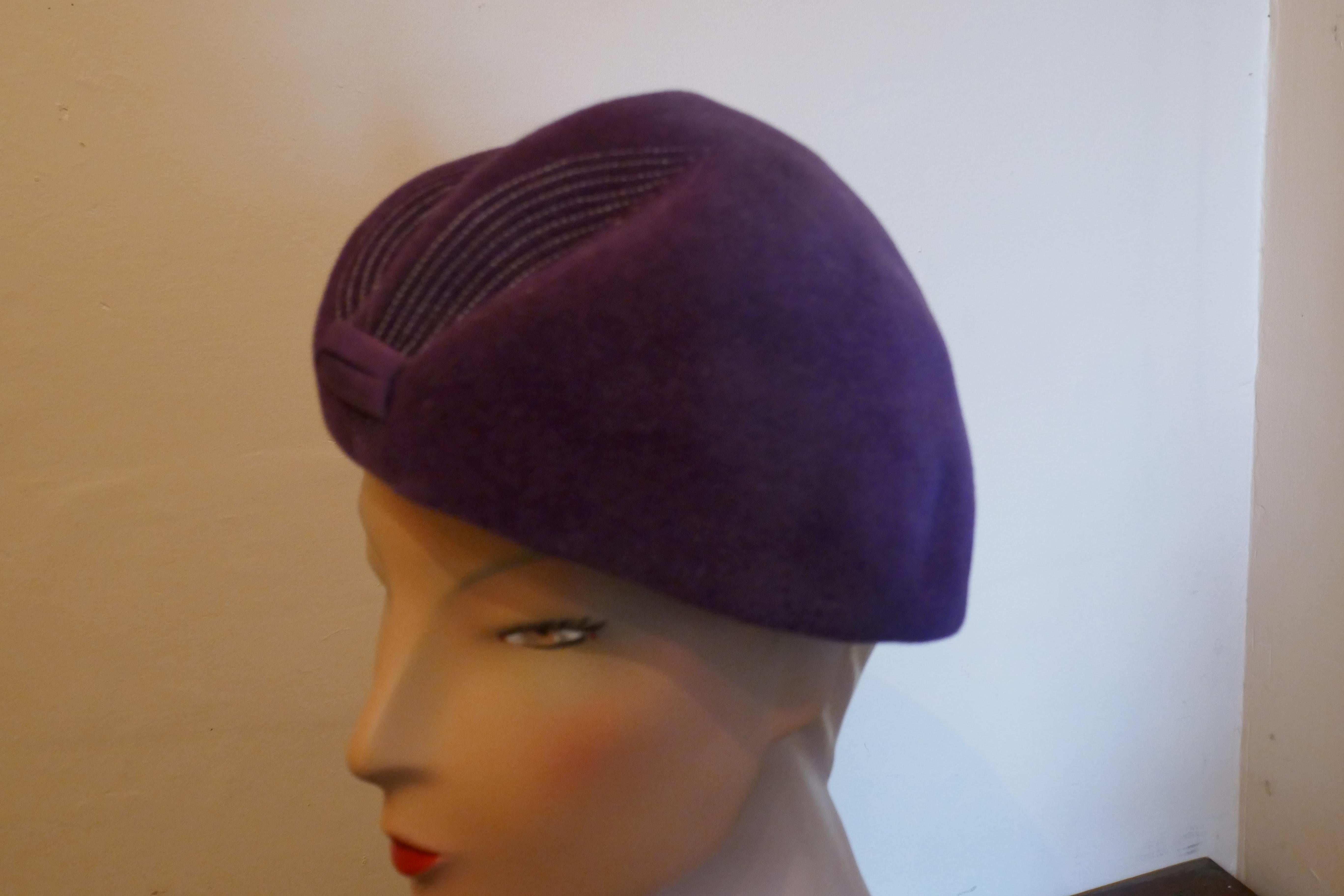 Original 1950s Purple Fur Felt Pill Box Hat, 

This gorgeous Hat is very light and has a very attractive shape, it is made in wool felt and is beautifully soft to the touch
This one is an exquisite design wear it anywhere 
The hat is in good