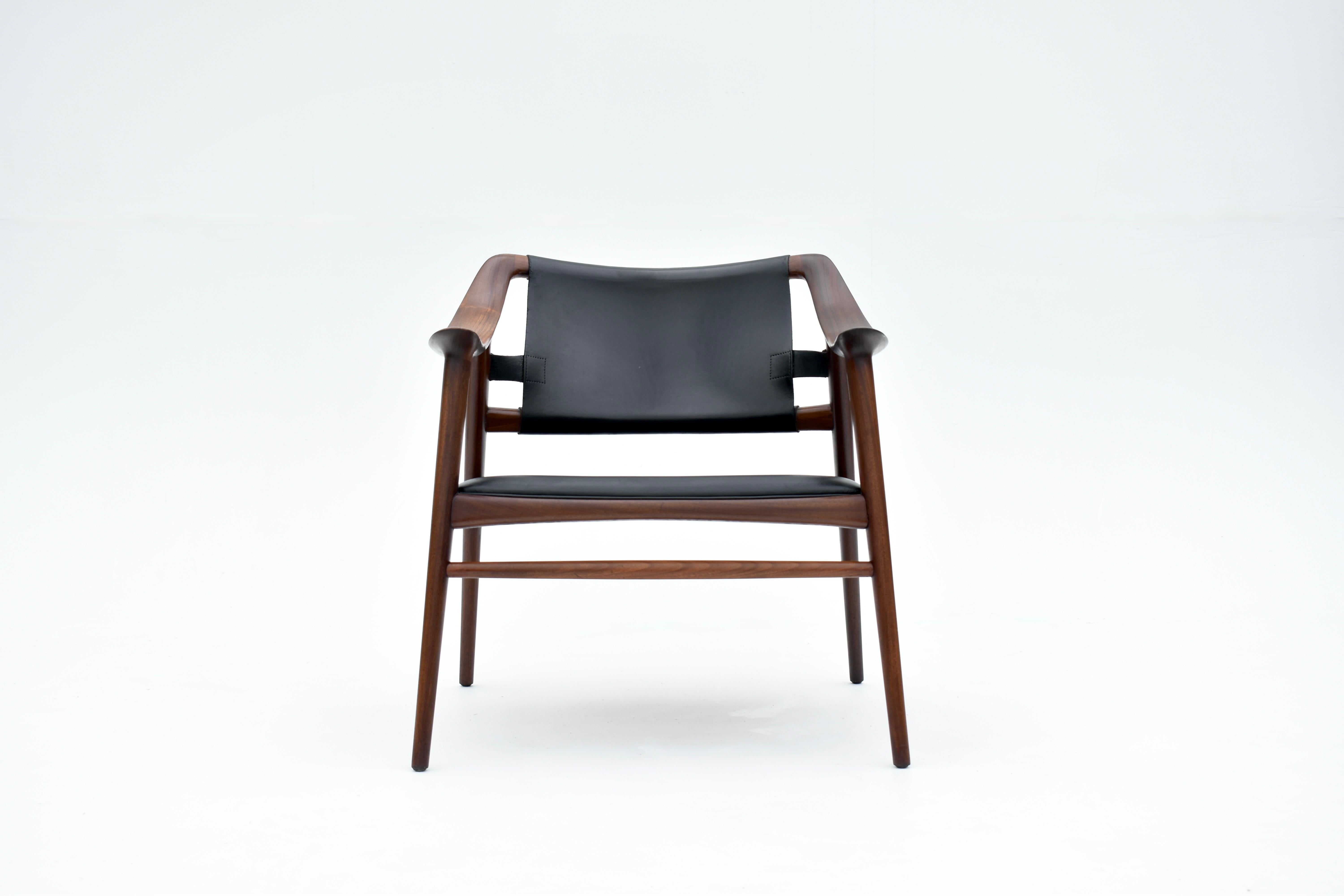 Outstanding and very sculptural solid Teak lounge chair designed in 1954 by Adolf Relling & Rolf Rastad, produced by Gustav Bahus & Eft, Norway.

A very rarely seen design. This variant with the fully upholstered seat appears to be especially