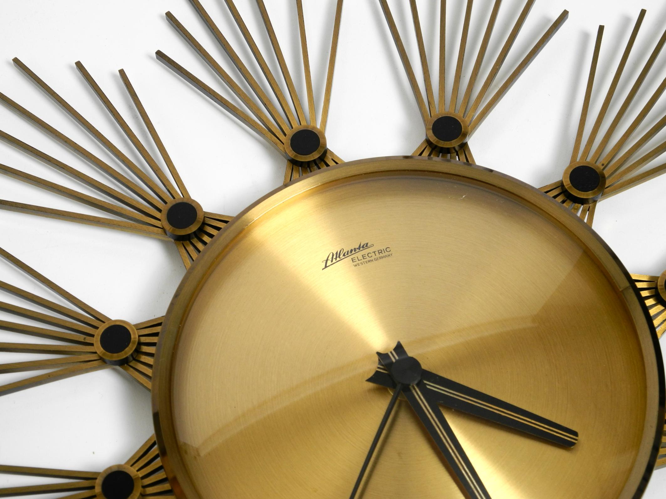 Mid-20th Century Original 1950s Sunburst wall clock by Atlanta made of brass and battery operated For Sale