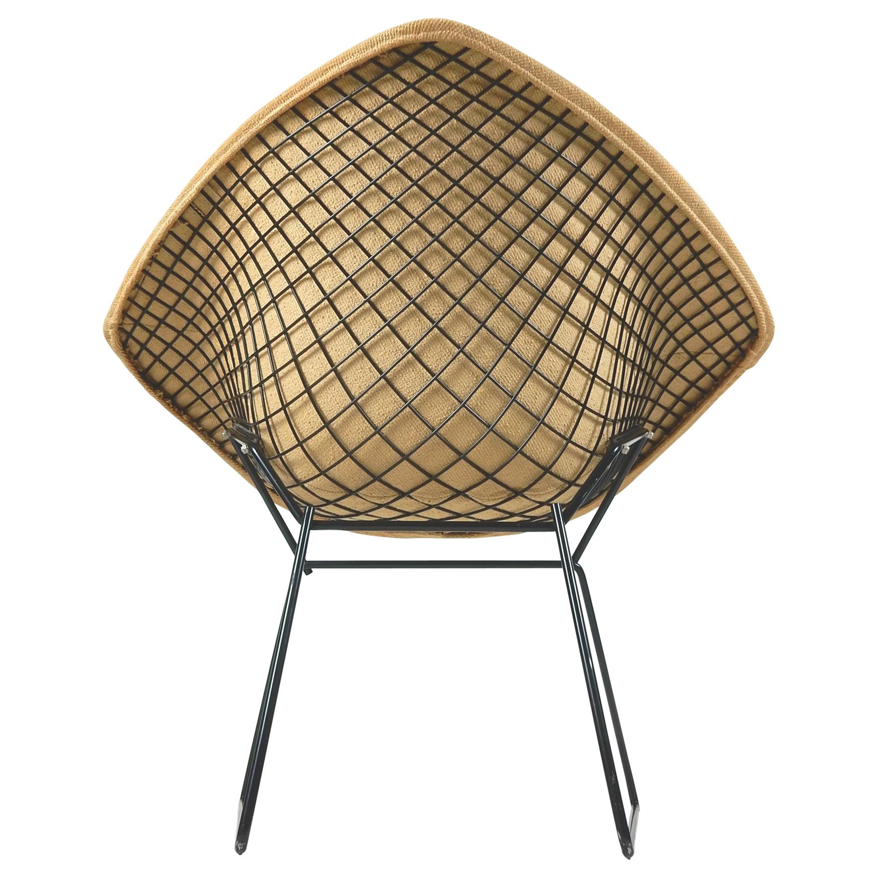 Rare early production of the diamond chair by Harry Bertoia. 
Completely original upholstery and black finish. Tagged 