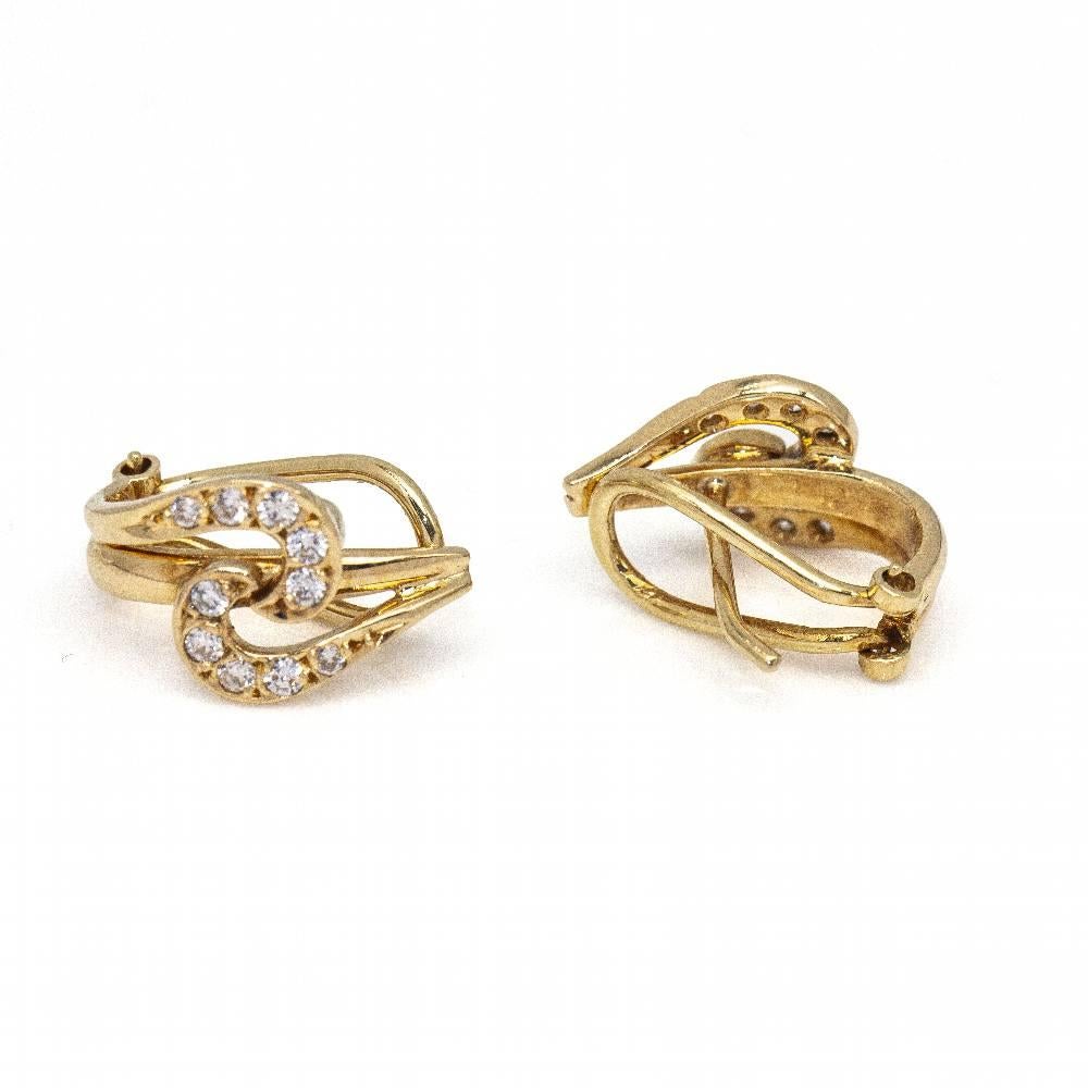 Women's Yellow Gold Earrings  20x Brilliant Cut Diamonds, total weight approx. 0.22 cts  Omega Clasp  18kt Yellow Gold  3.80 grams  Measures: 15mm long  These earrings are in excellent condition, with no visible wear and tear  Ref.D361042JC