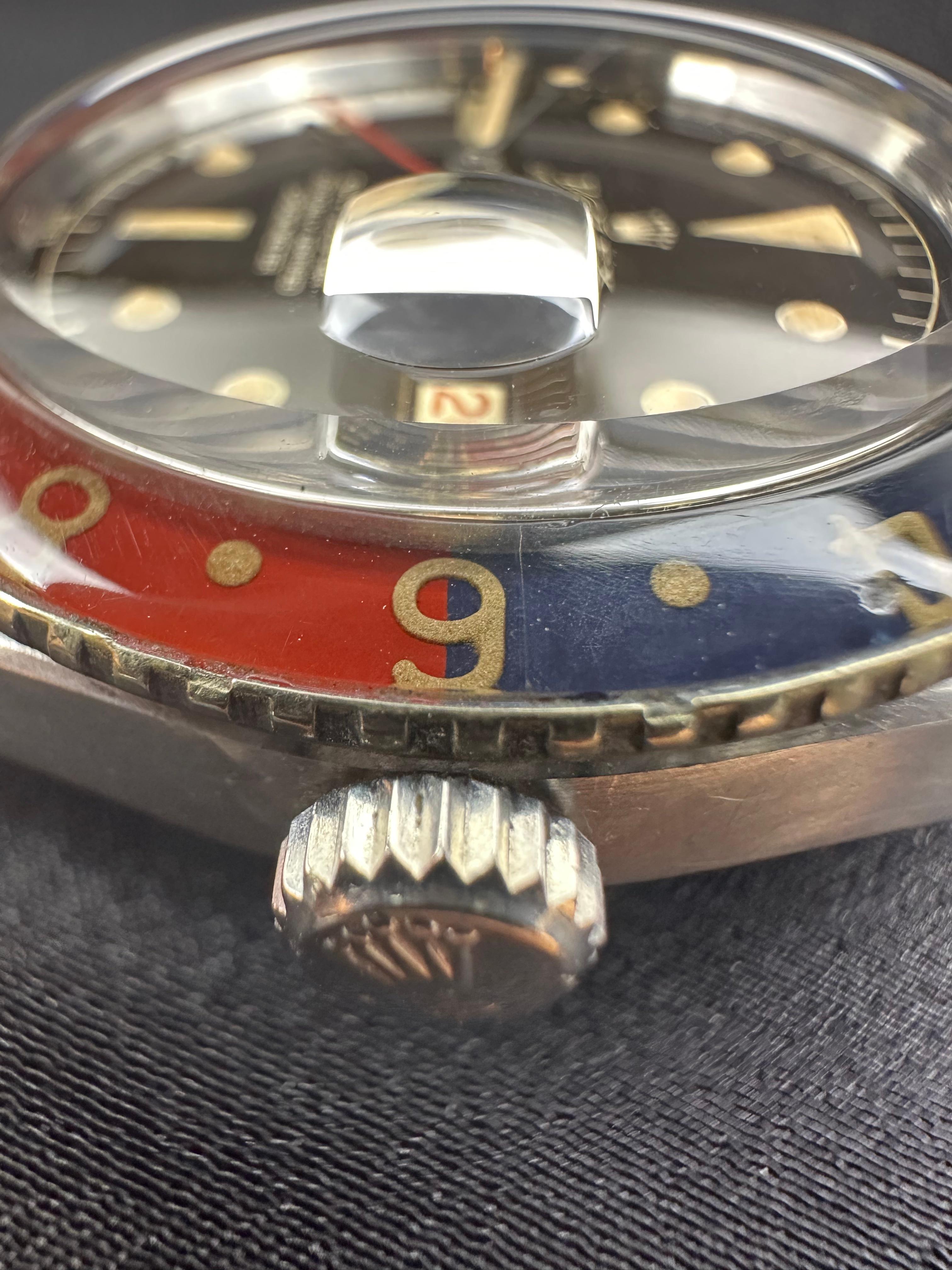 Rare and gorgeous example of the original version Rolex GMT Master Reference 6542 wristwatch in excellent condition for its 65 year old age. The Iconic Reference 6542 was originally designed by Rolex for the pilots of Pan Am Airlines and was